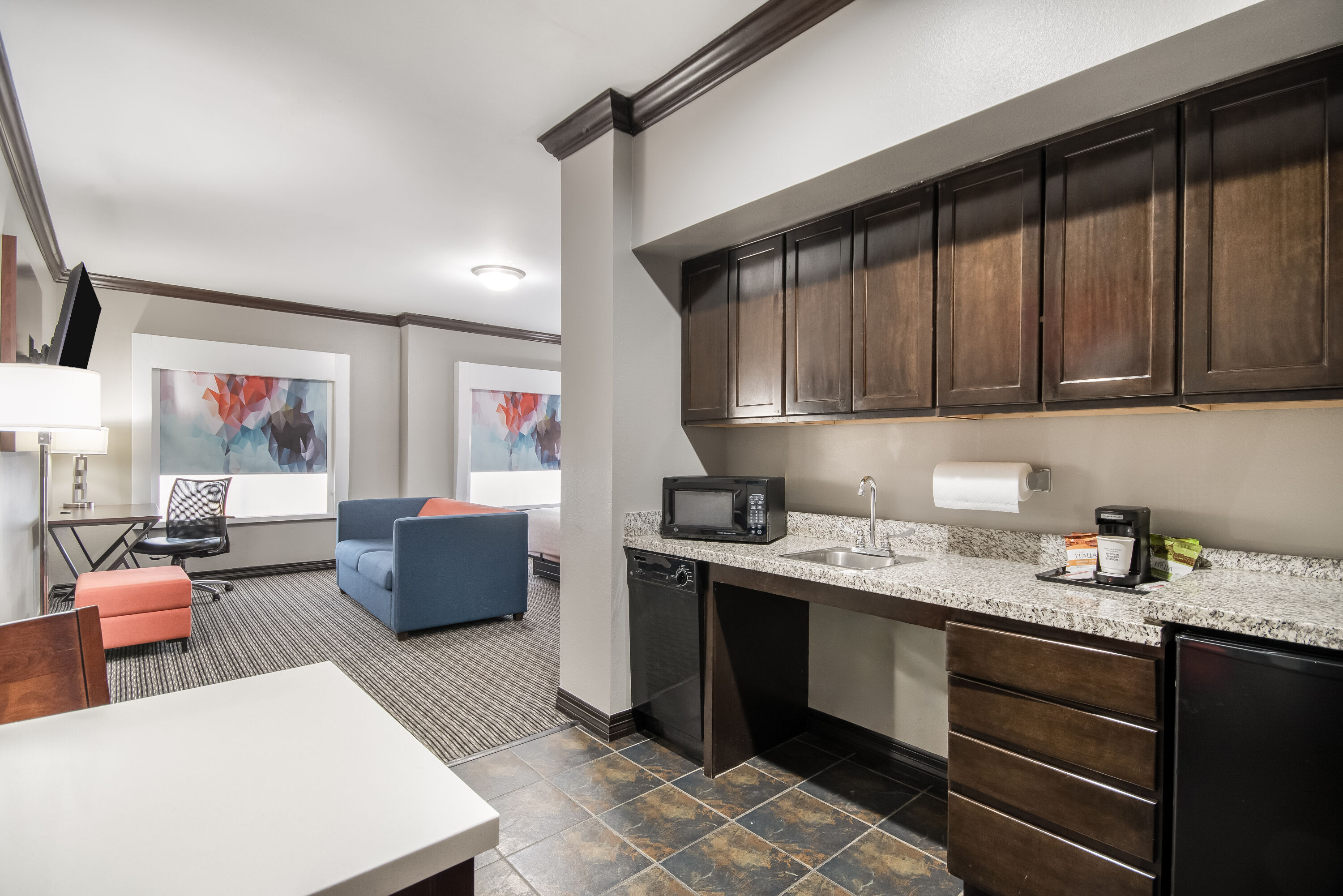 King bed guest room at the Hawthorn Suites by Wyndham Lubbock in Lubbock, Texas