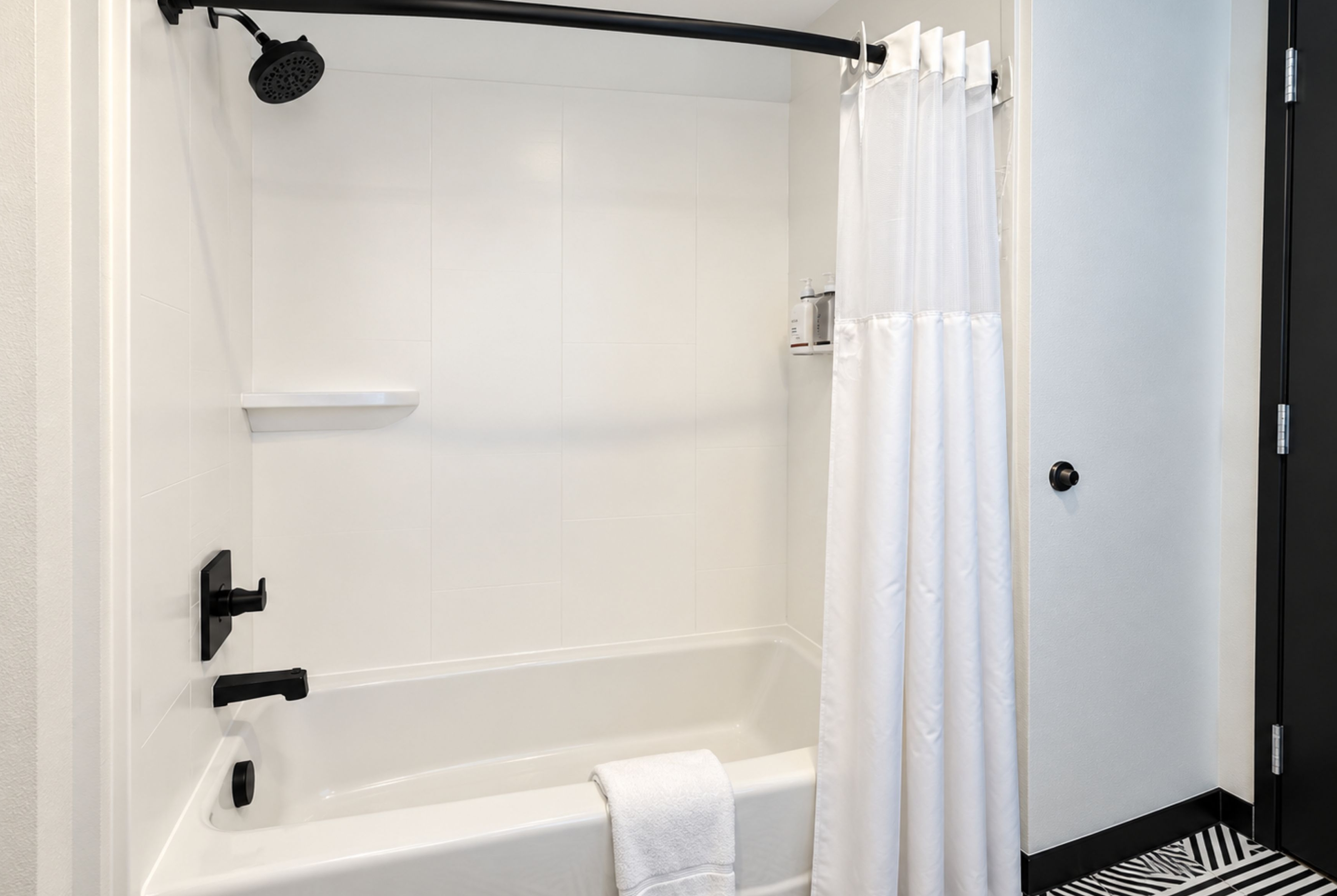 Guest room bath at the Hawthorn Extended Stay by Wyndham Central McKinney in McKinney, Texas