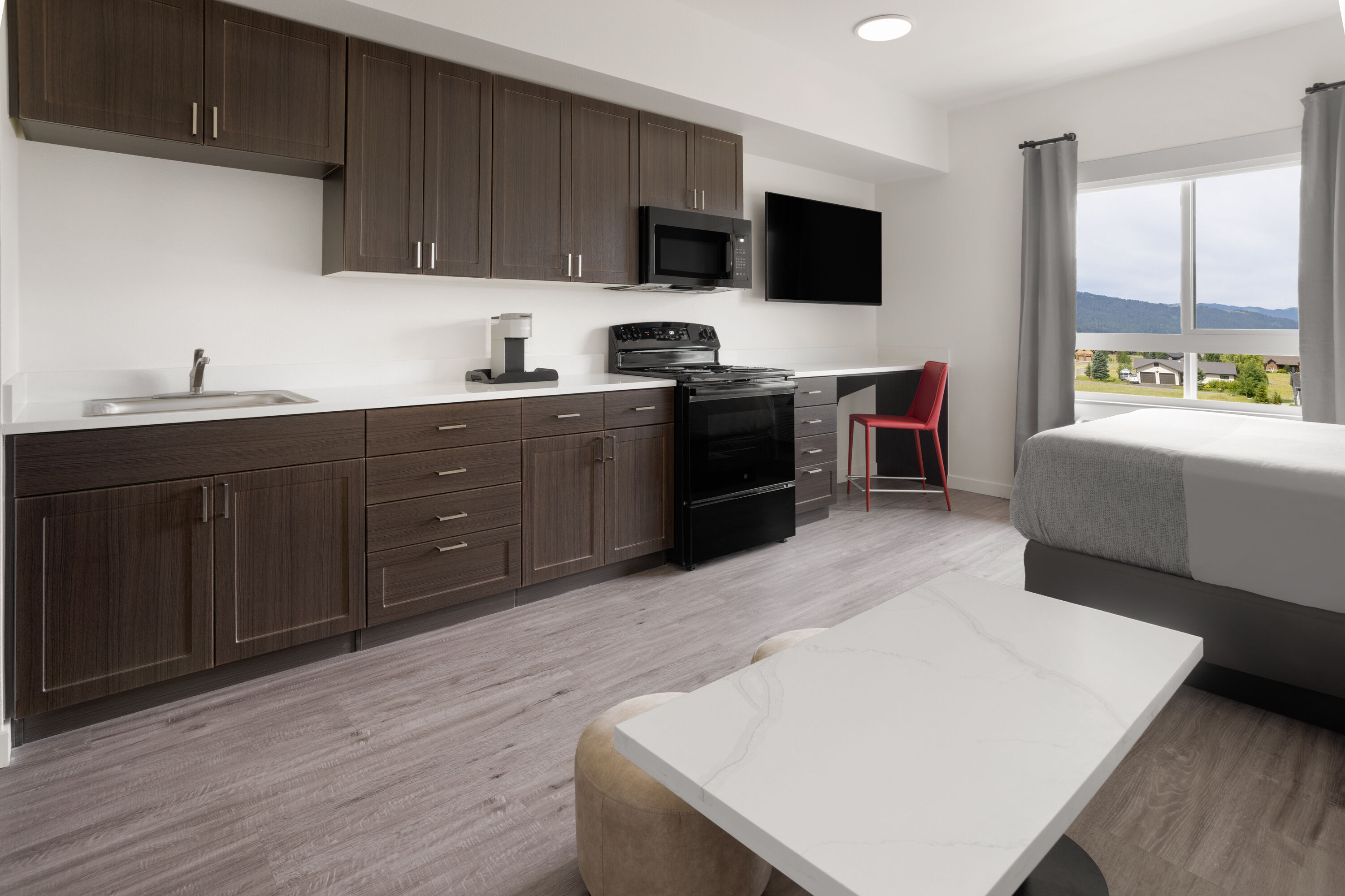 Guest room at the Hawthorn Extended Stay by Wyndham Jackson Alpine in Alpine, Wyoming