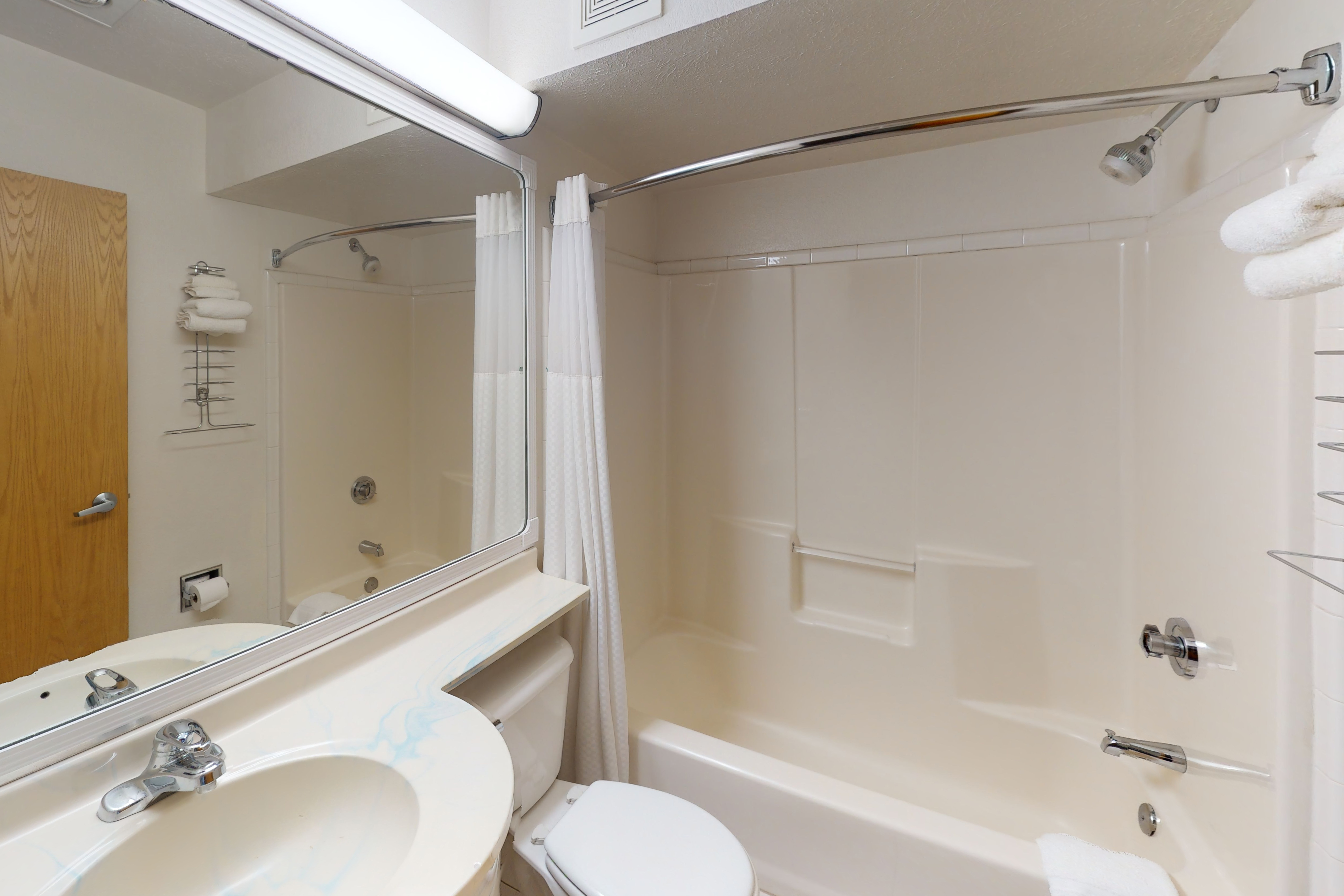 Guest room bath at the Baymont Inn & Suites by Wyndham Anchorage Airport in Anchorage, Alaska