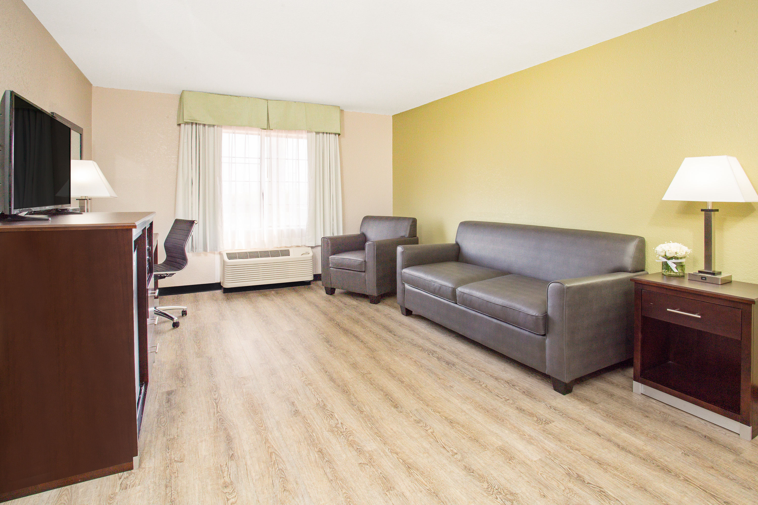 Baymont by Wyndham Phoenix I-10 near 51st Ave suite living room in Phoenix, Arizona