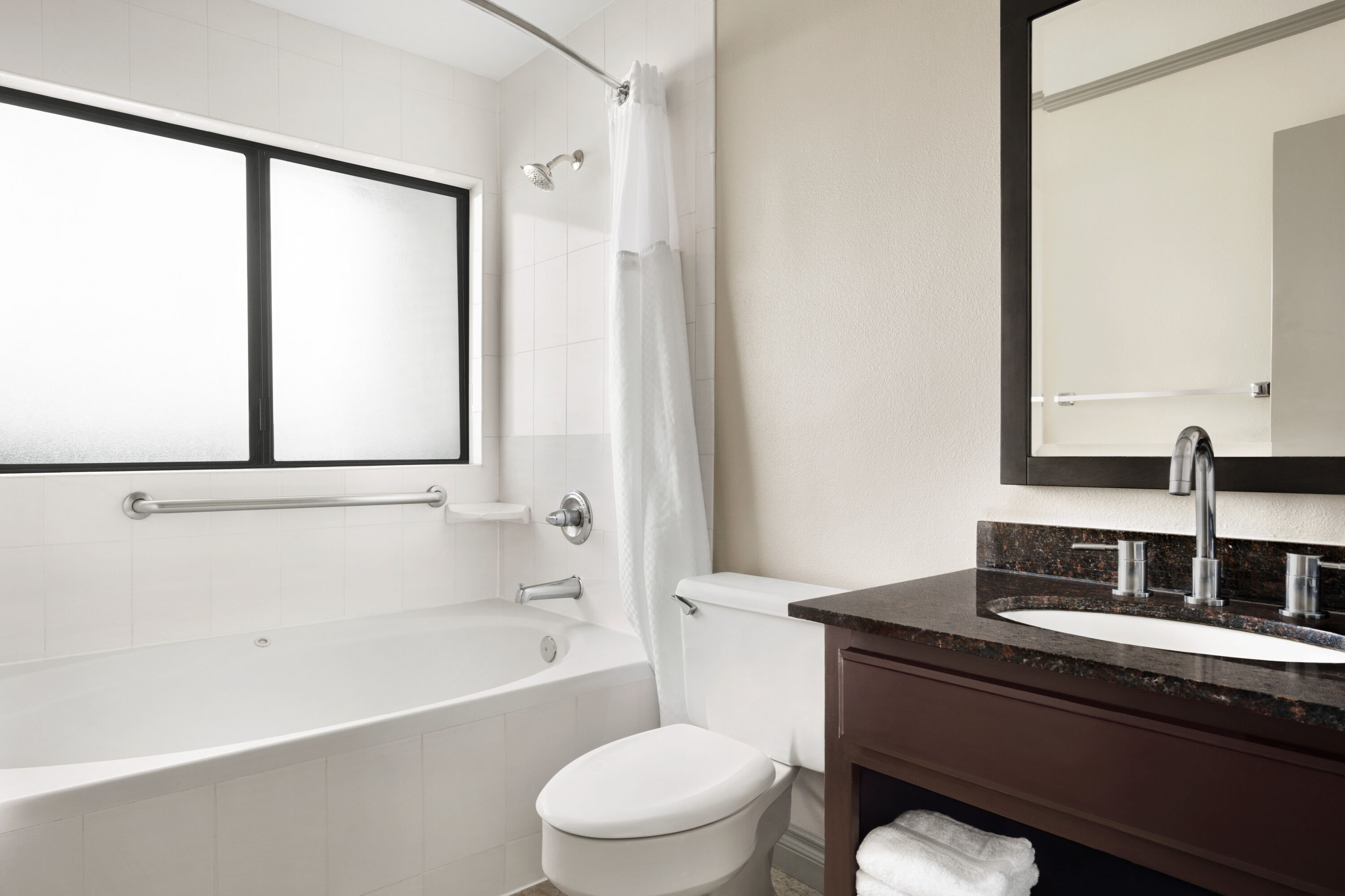 Guest room bath at the Baymont by Wyndham Monterey Park in Monterey Park, California