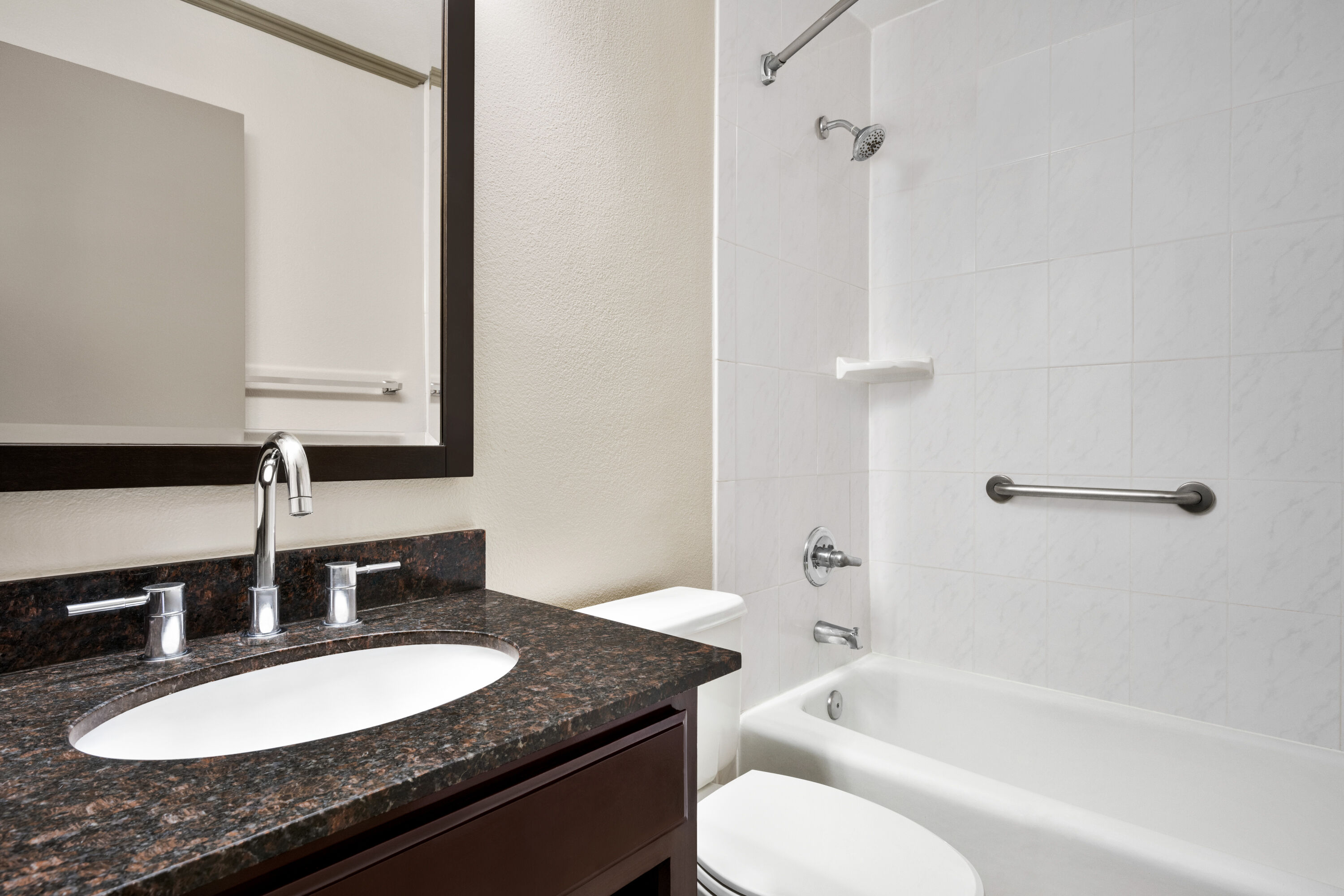 Guest room bath at the Baymont by Wyndham Monterey Park in Monterey Park, California