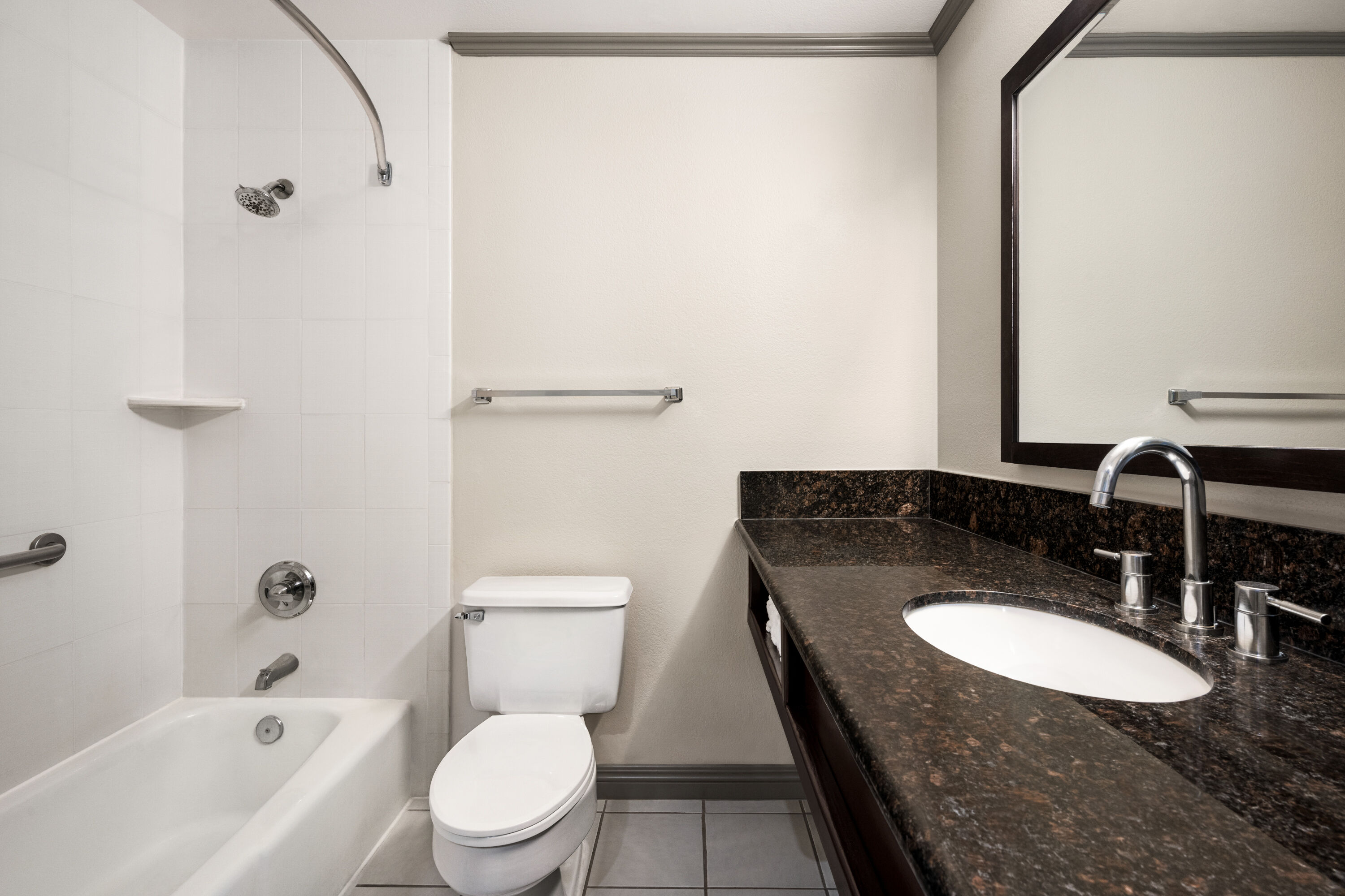 Guest room bath at the Baymont by Wyndham Monterey Park in Monterey Park, California