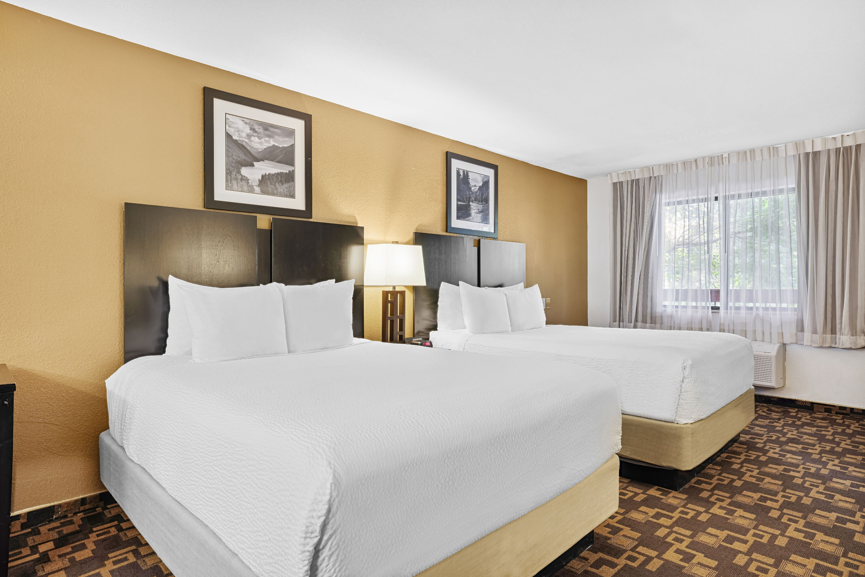 Queen bed guest room at the Baymont by Wyndham Cortez in Cortez, Colorado