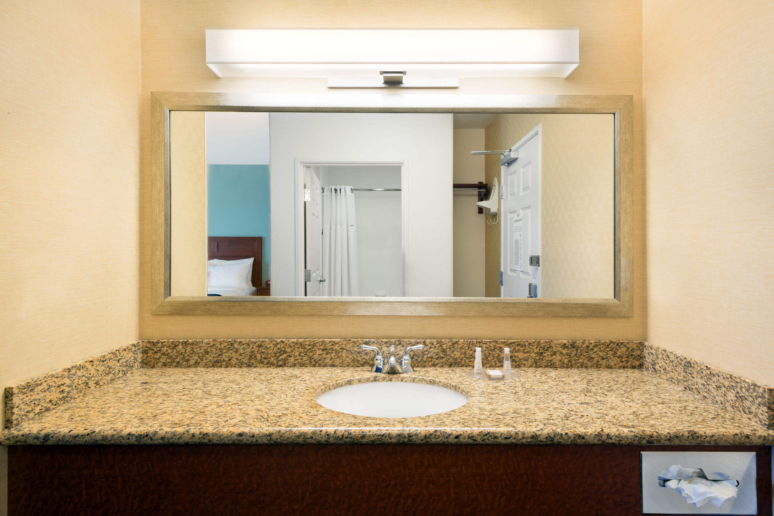 Guest room bath at the Baymont by Wyndham Denver International Airport in Denver, Colorado