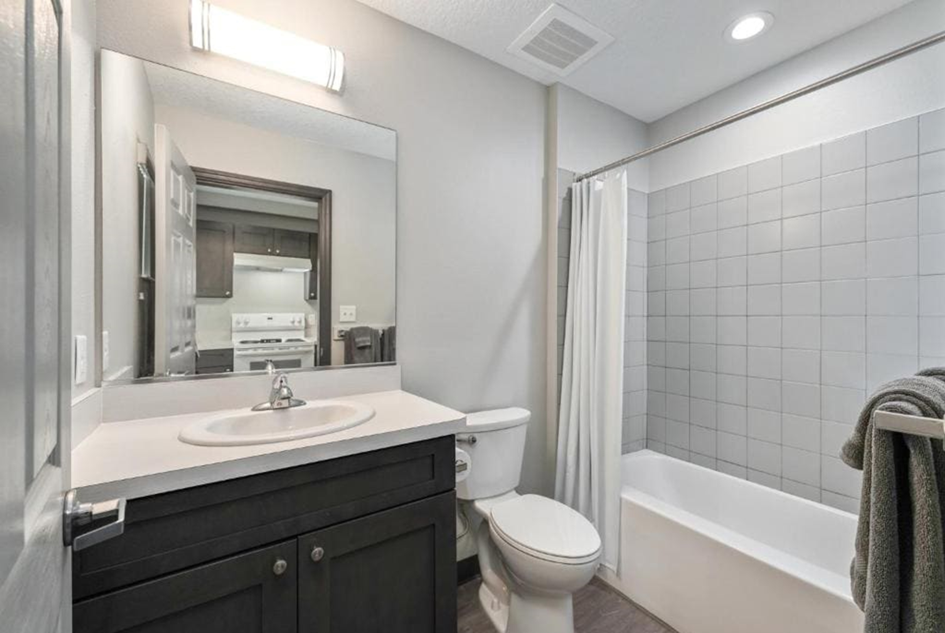 Guest room bath at the Baymont by Wyndham Ocala Suites in Ocala, Florida