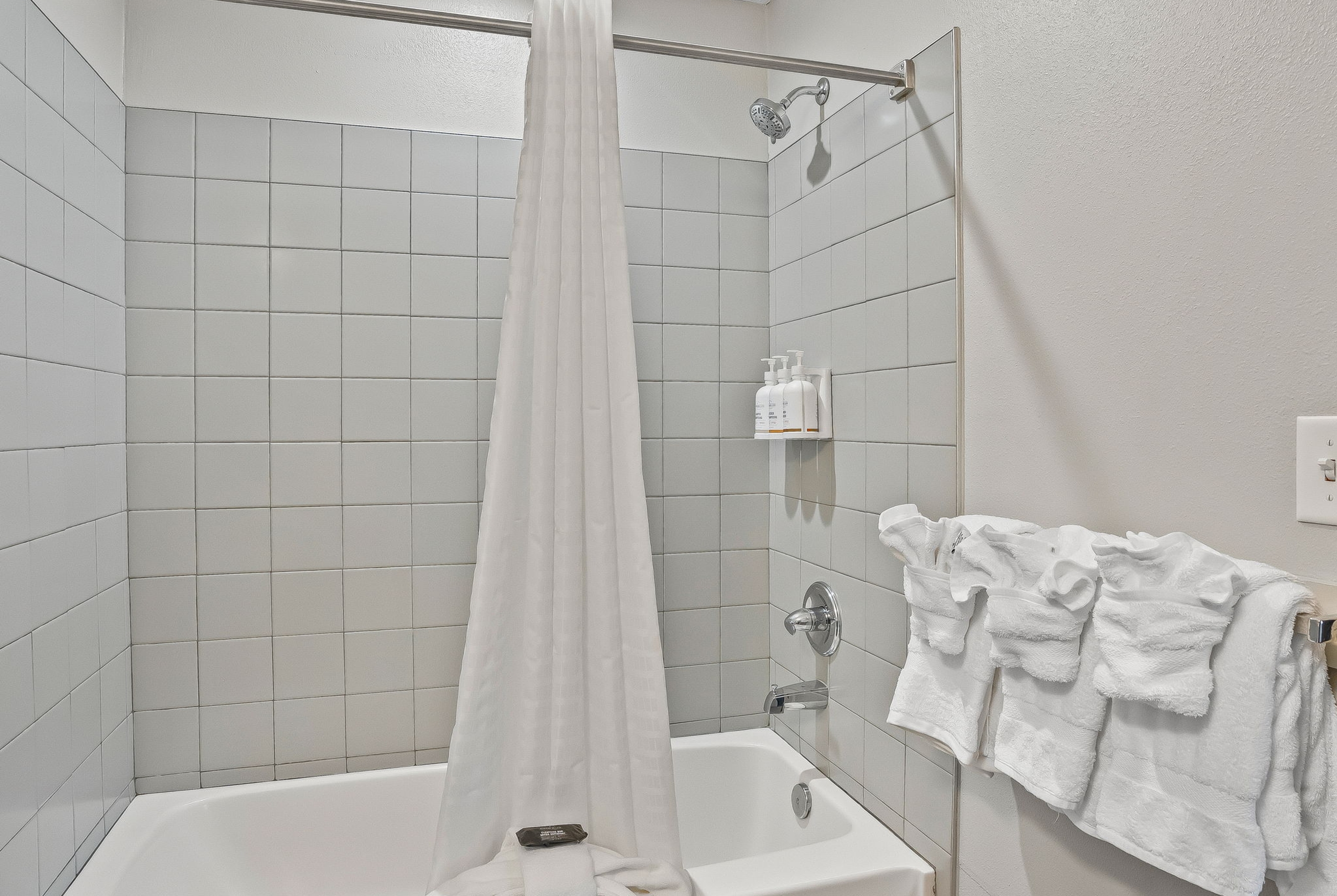 Guest room bath at the Baymont by Wyndham Ocala Suites in Ocala, Florida