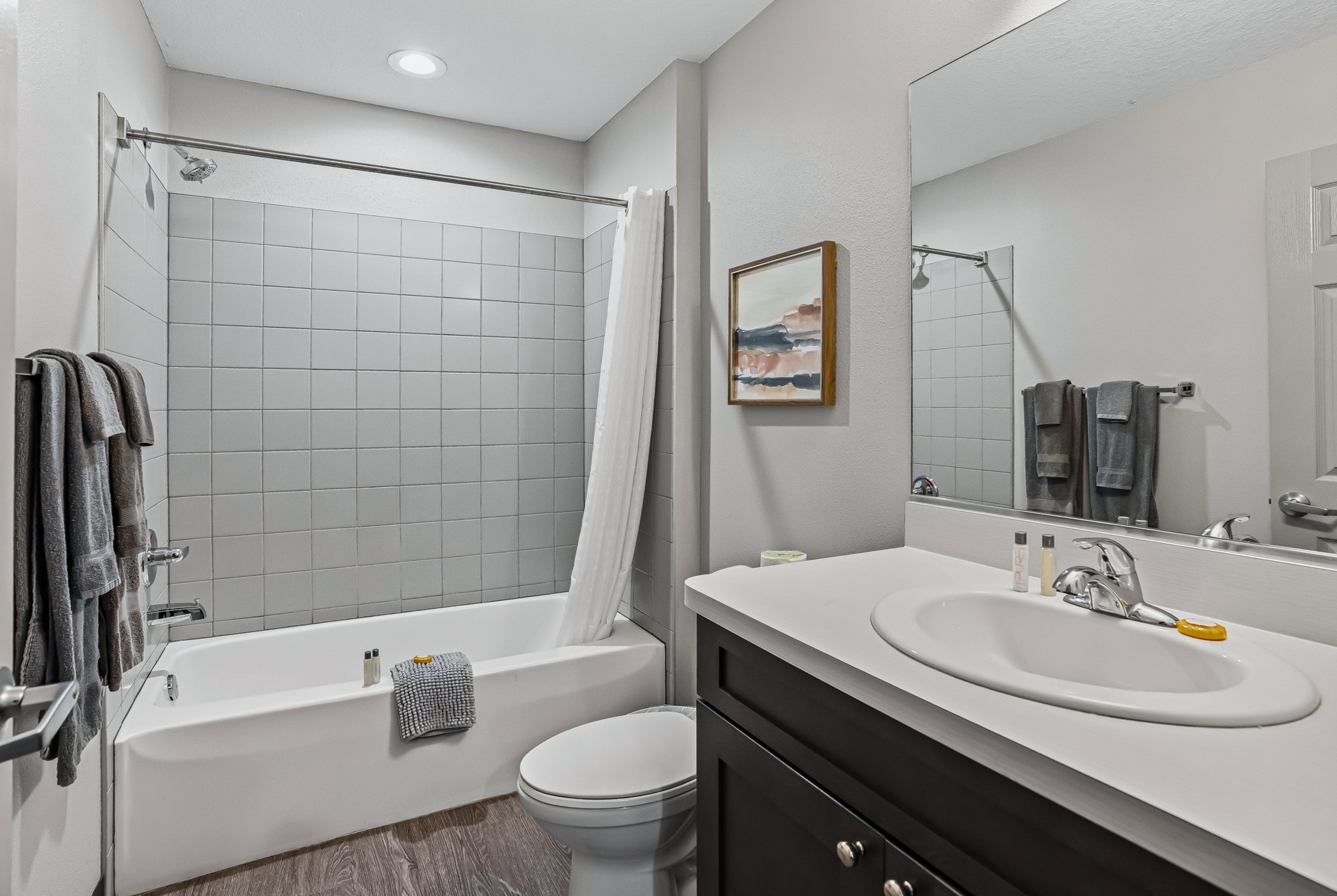 Guest room bath at the Baymont by Wyndham Ocala Suites in Ocala, Florida