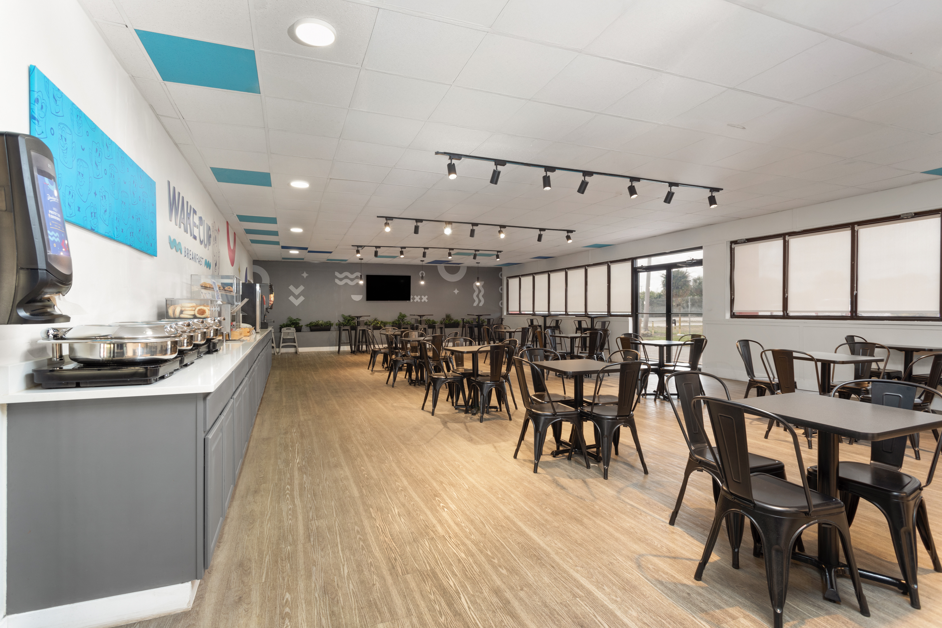 Baymont by Wyndham Orlando North Millenia restaurant breakfast area with seating in Orlando, Florida