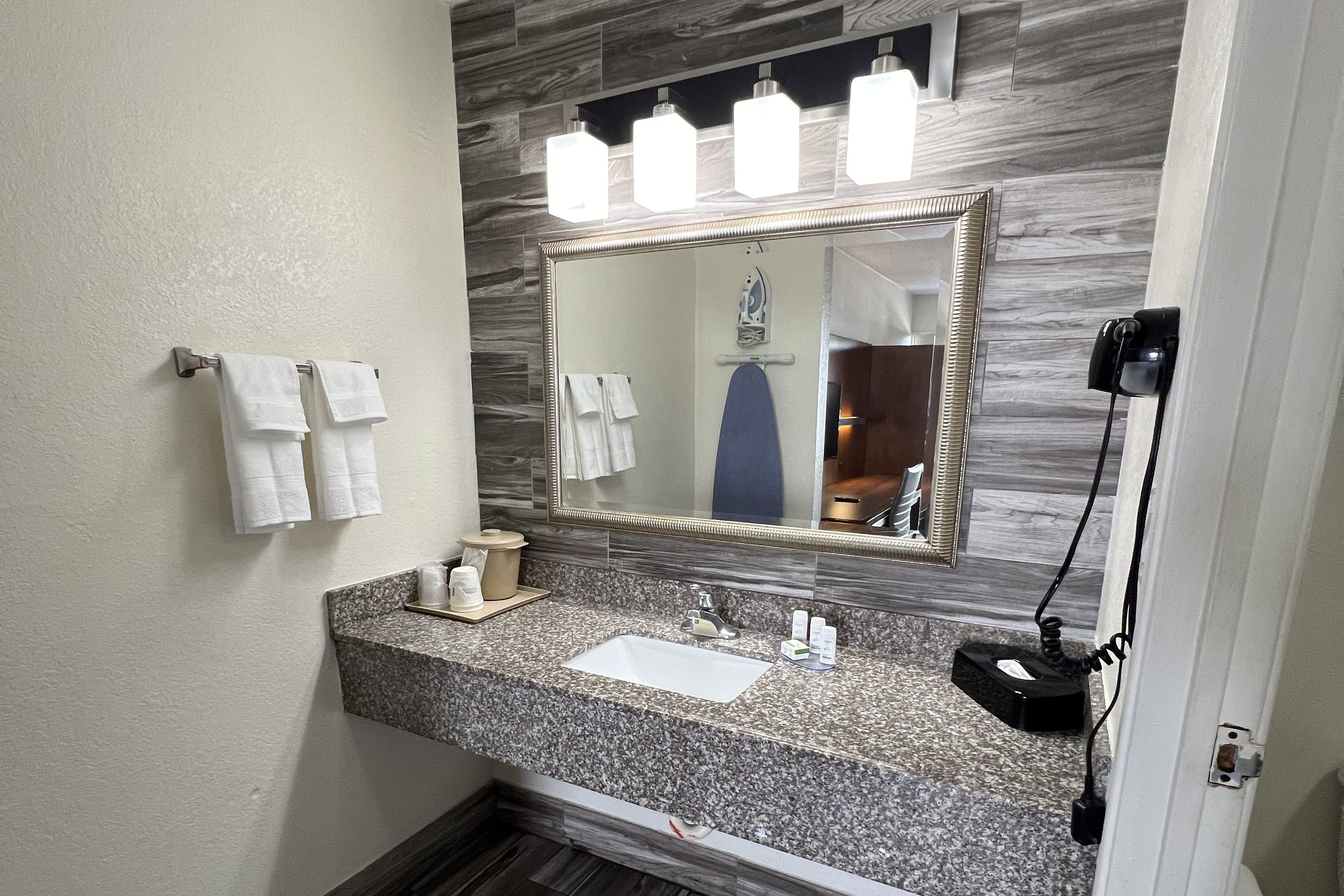 Guest room bath at the Baymont by Wyndham Orlando Downtown in Orlando, Florida