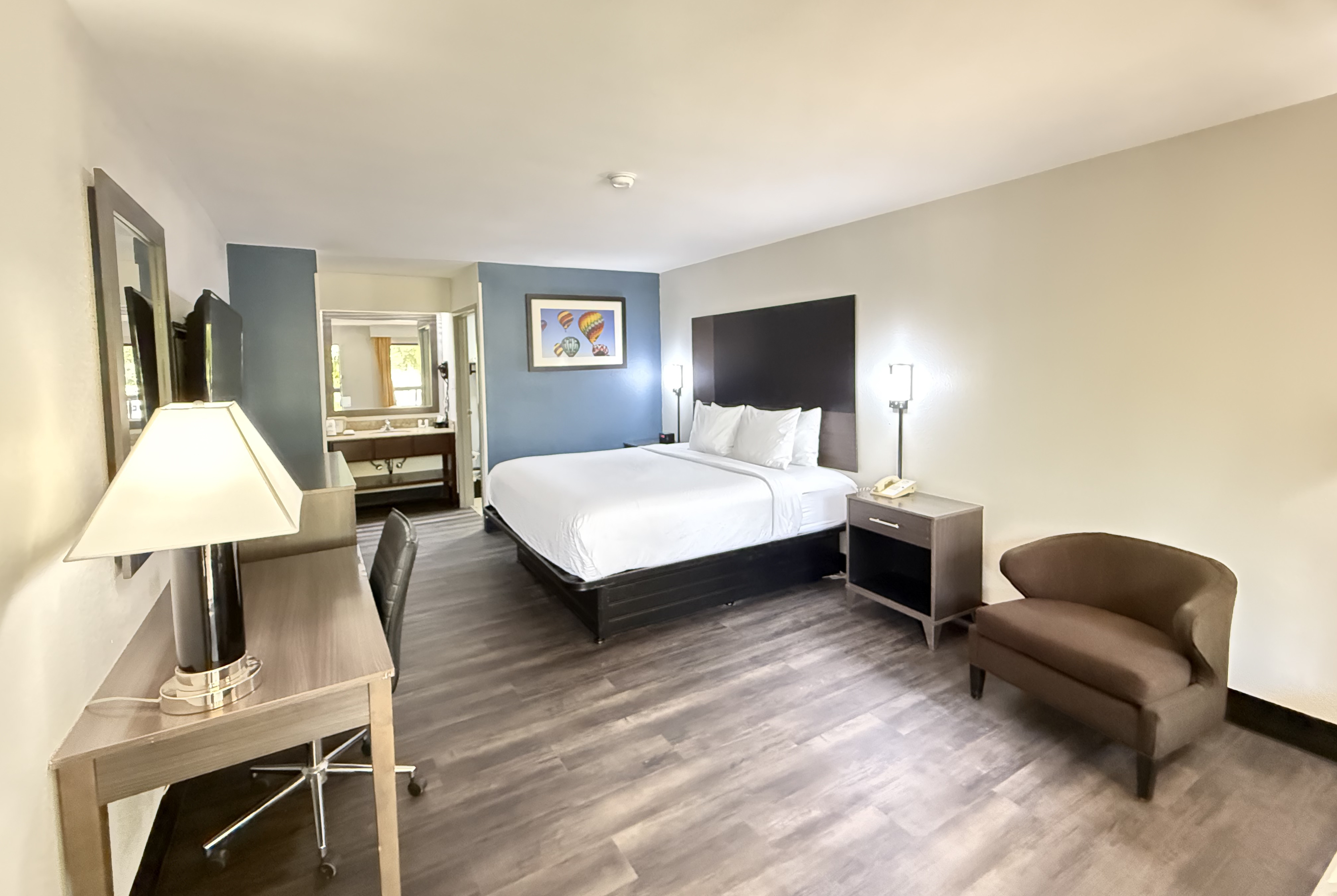 King bed guest room at the Baymont by Wyndham Tallahassee in Tallahassee, Florida