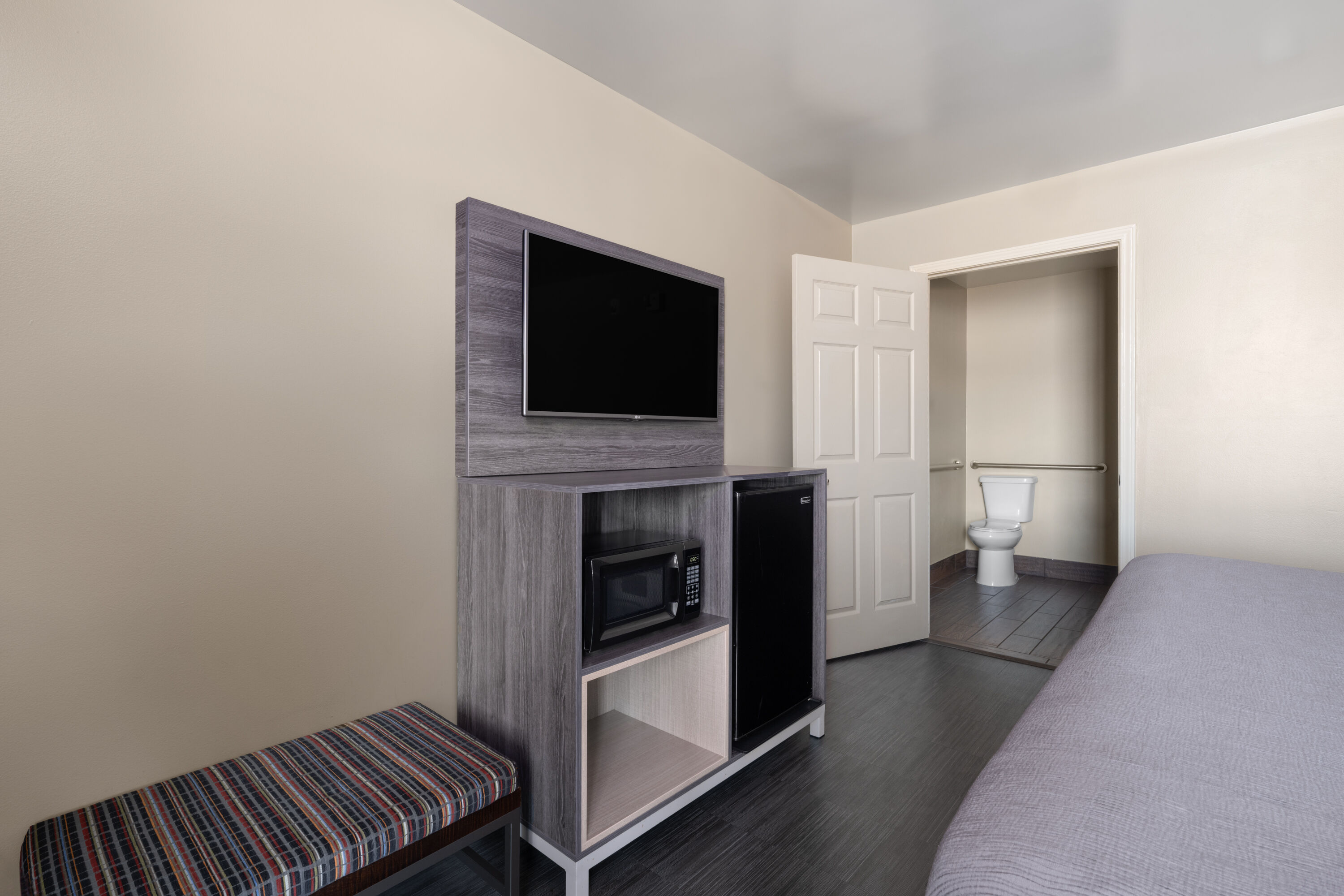 Guest room at the Baymont by Wyndham Commerce GA Near Tanger Outlets Mall in Commerce, Georgia