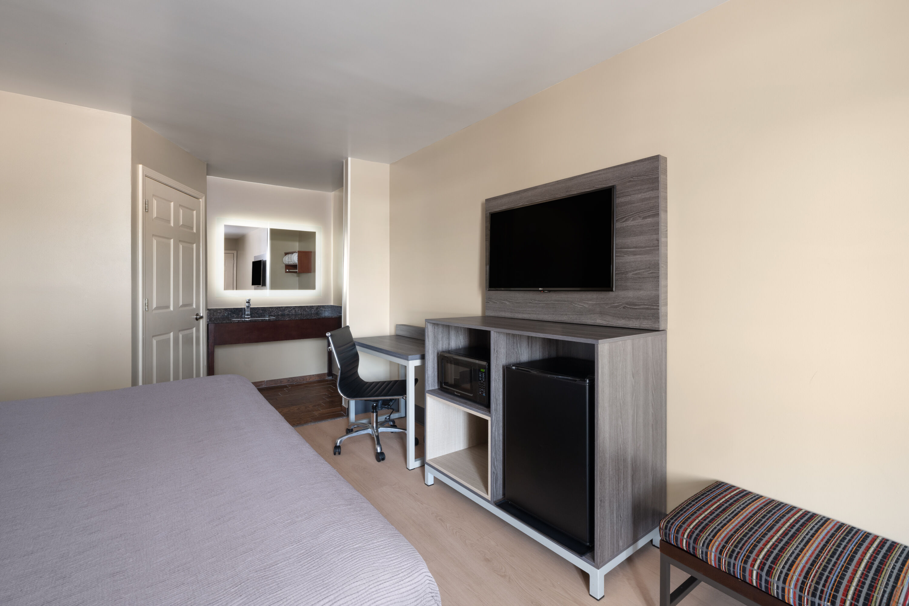 Guest room at the Baymont by Wyndham Commerce GA Near Tanger Outlets Mall in Commerce, Georgia