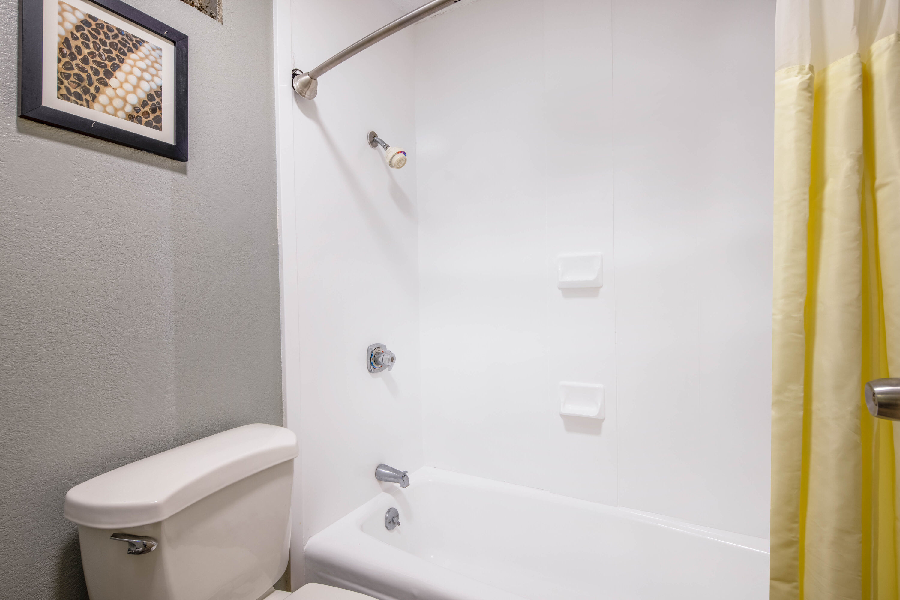 Guest room bath at the Baymont by Wyndham Covington in Covington, Georgia