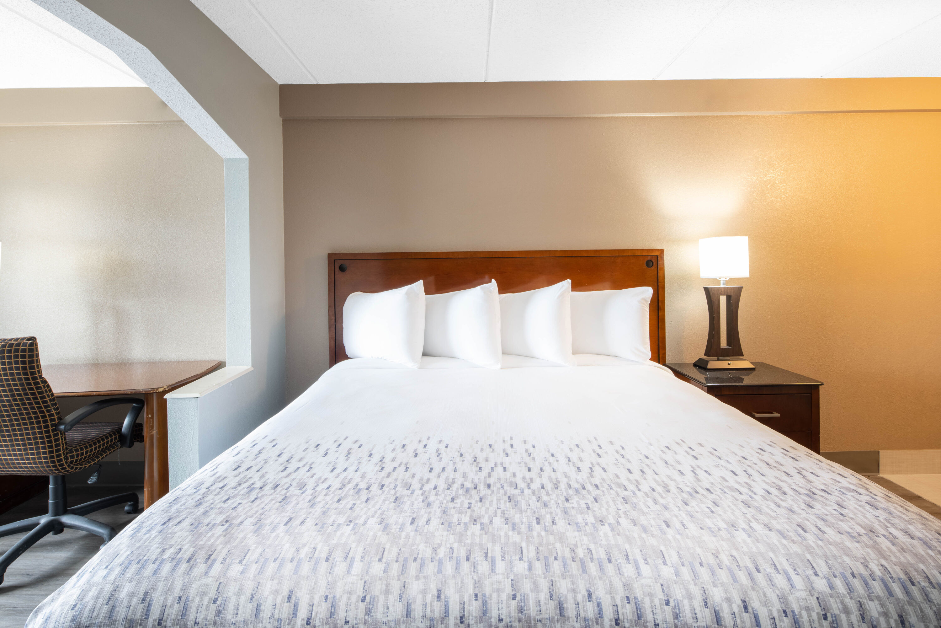 Guest room at the Baymont by Wyndham Covington in Covington, Georgia