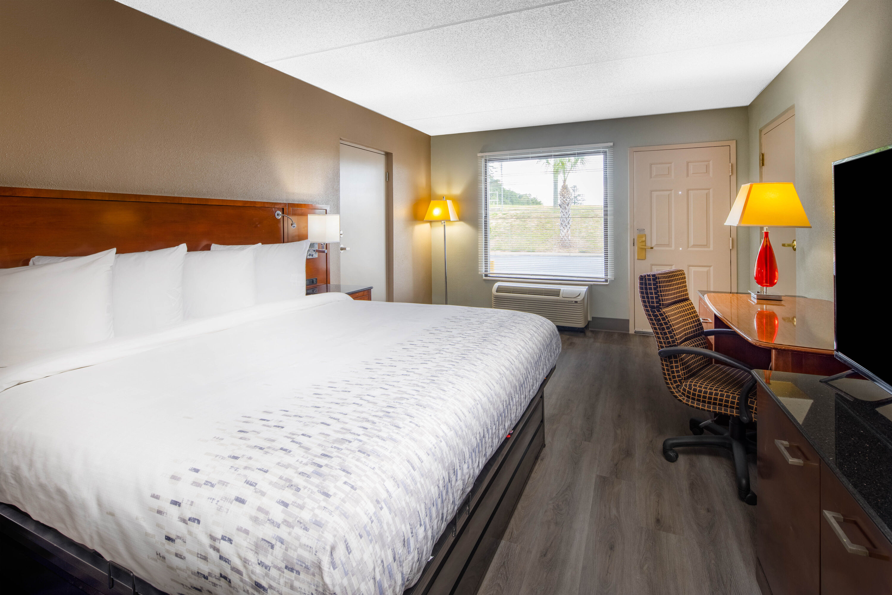 Guest room at the Baymont by Wyndham Covington in Covington, Georgia