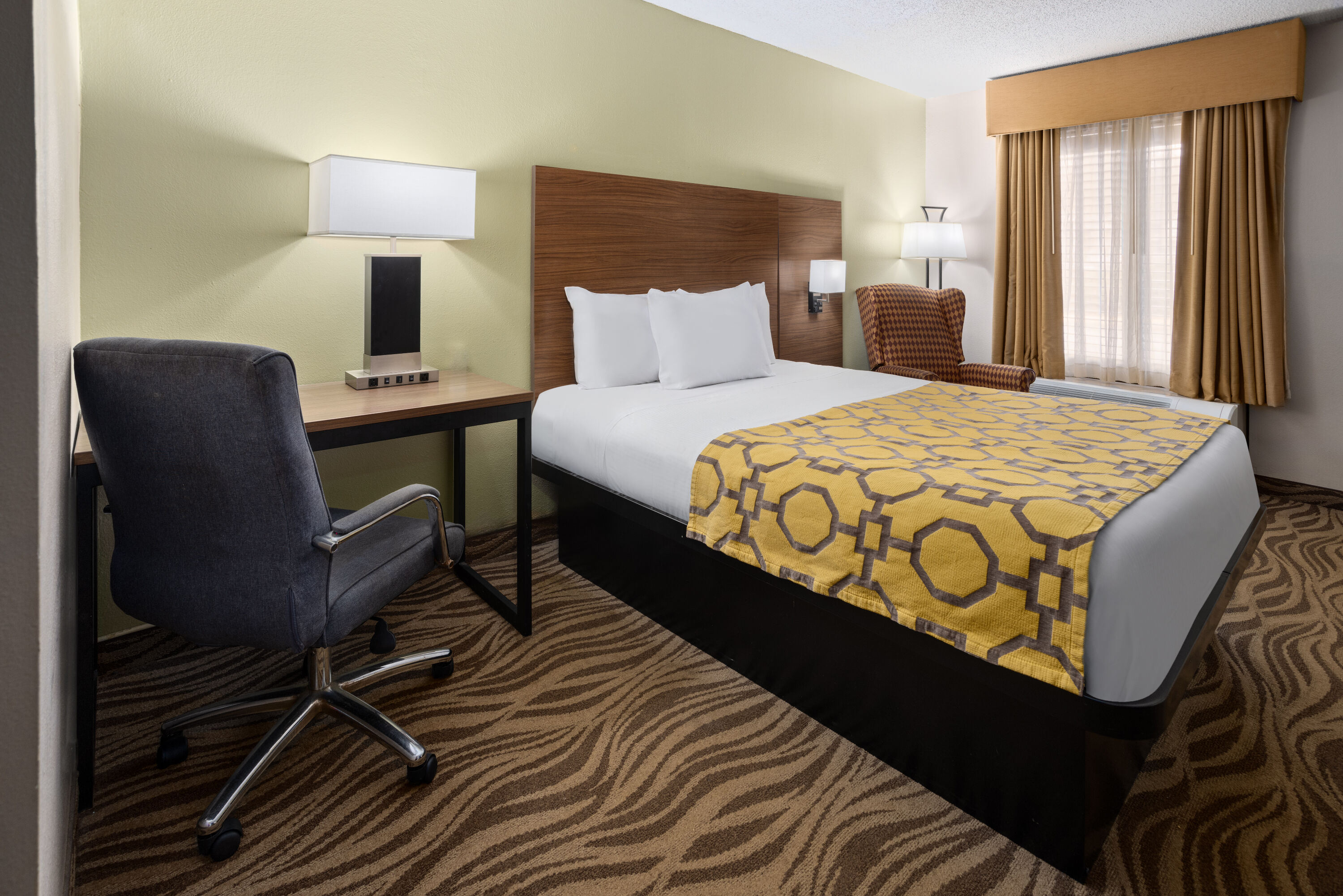 Guest room at the Baymont by Wyndham Griffin in Griffin, Georgia