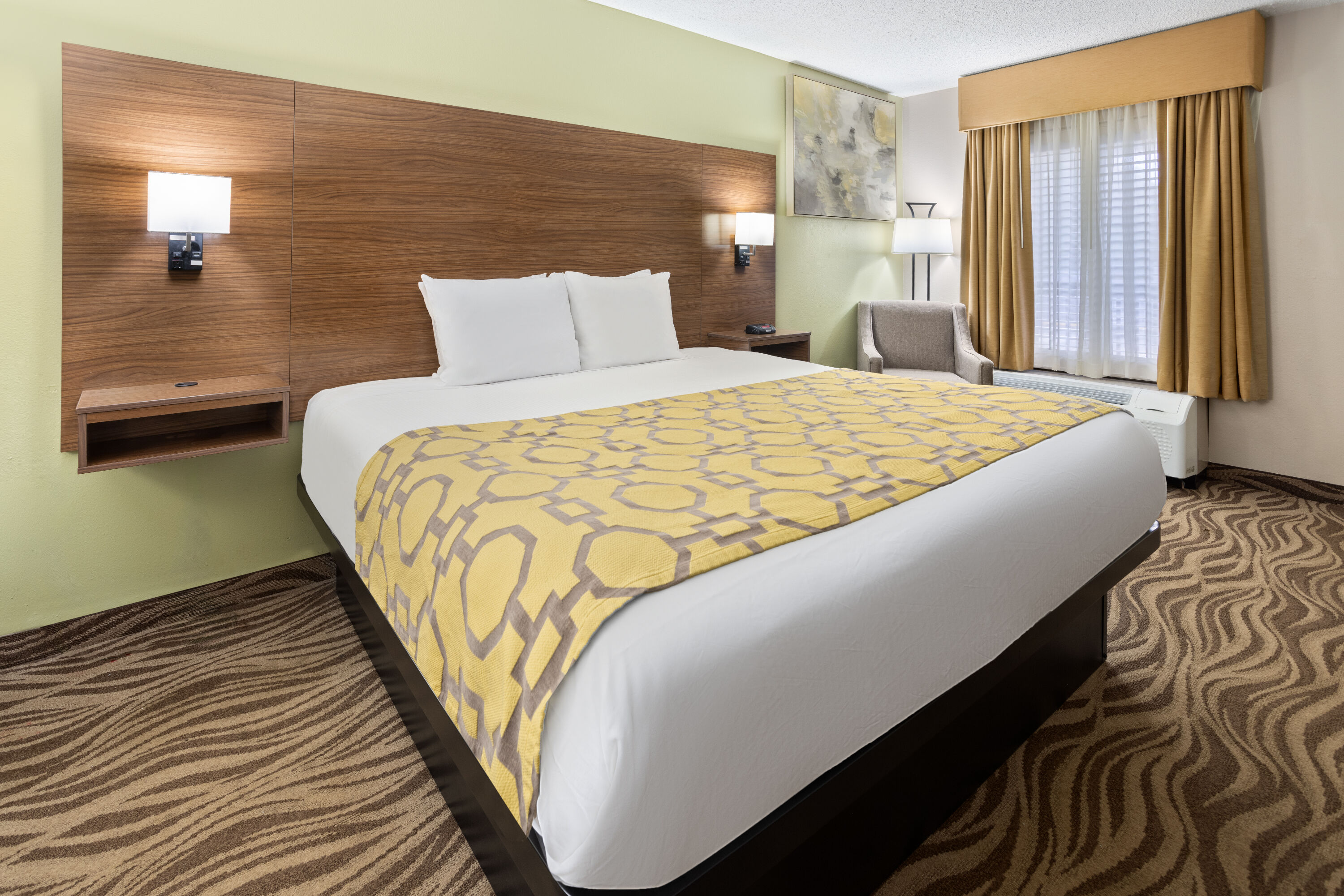 Guest room at the Baymont by Wyndham Griffin in Griffin, Georgia