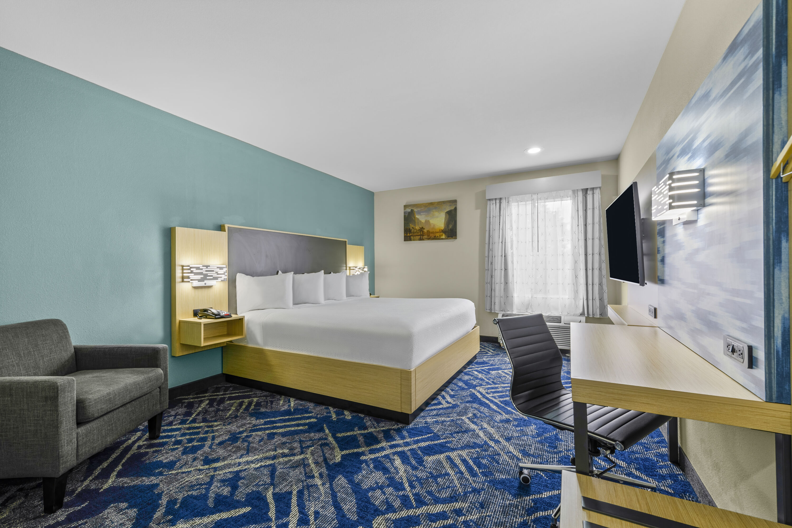 King bed guest room at the Baymont by Wyndham Grovetown Augusta in Grovetown, Georgia