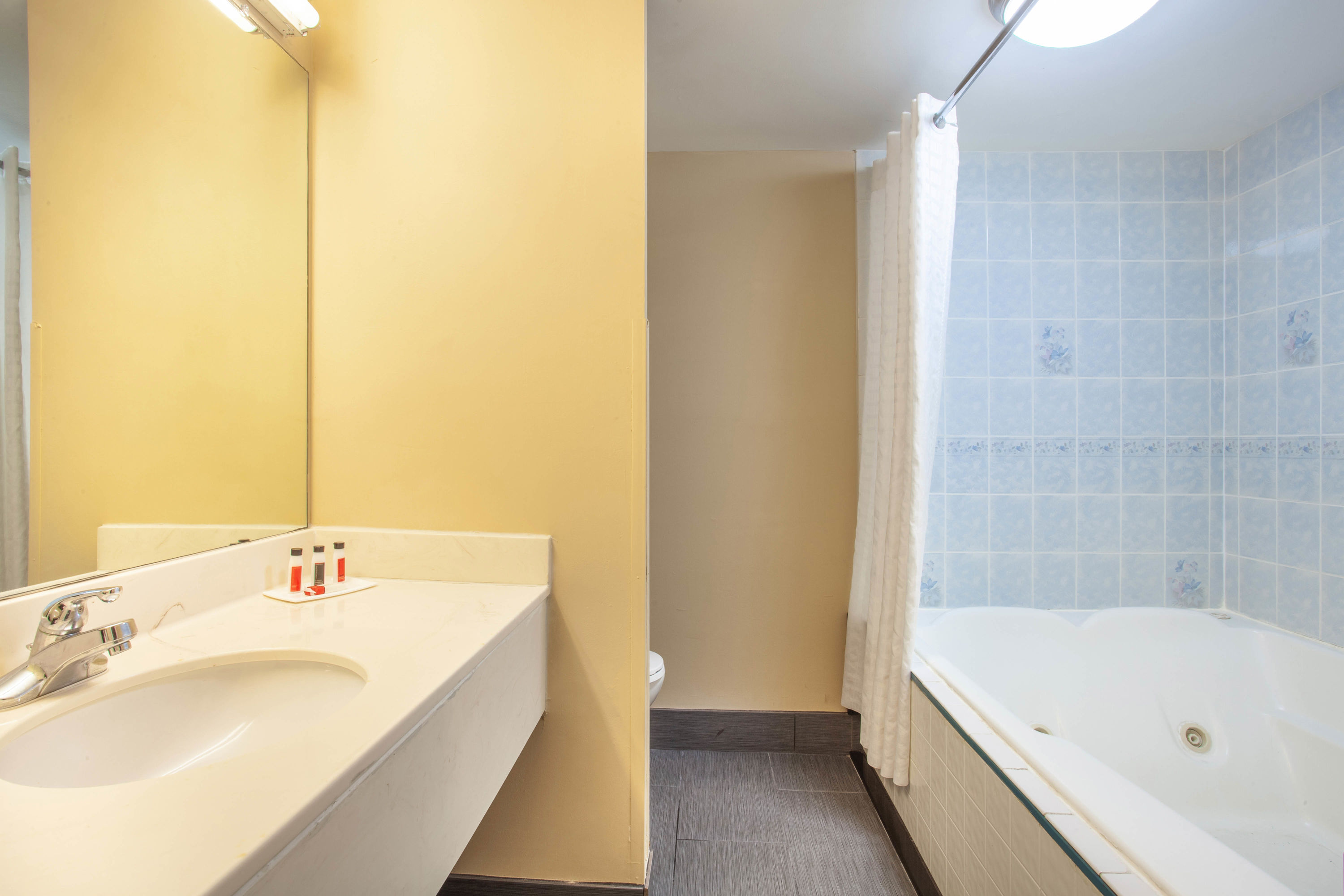 Guest room bath at the Baymont by Wyndham McDonough in McDonough, Georgia
