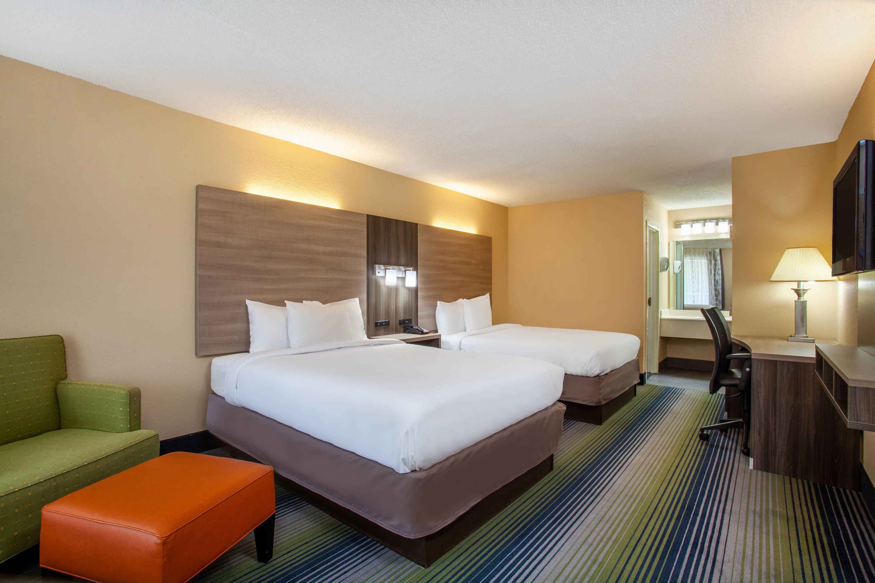 Guest room at the Baymont by Wyndham McDonough in McDonough, Georgia