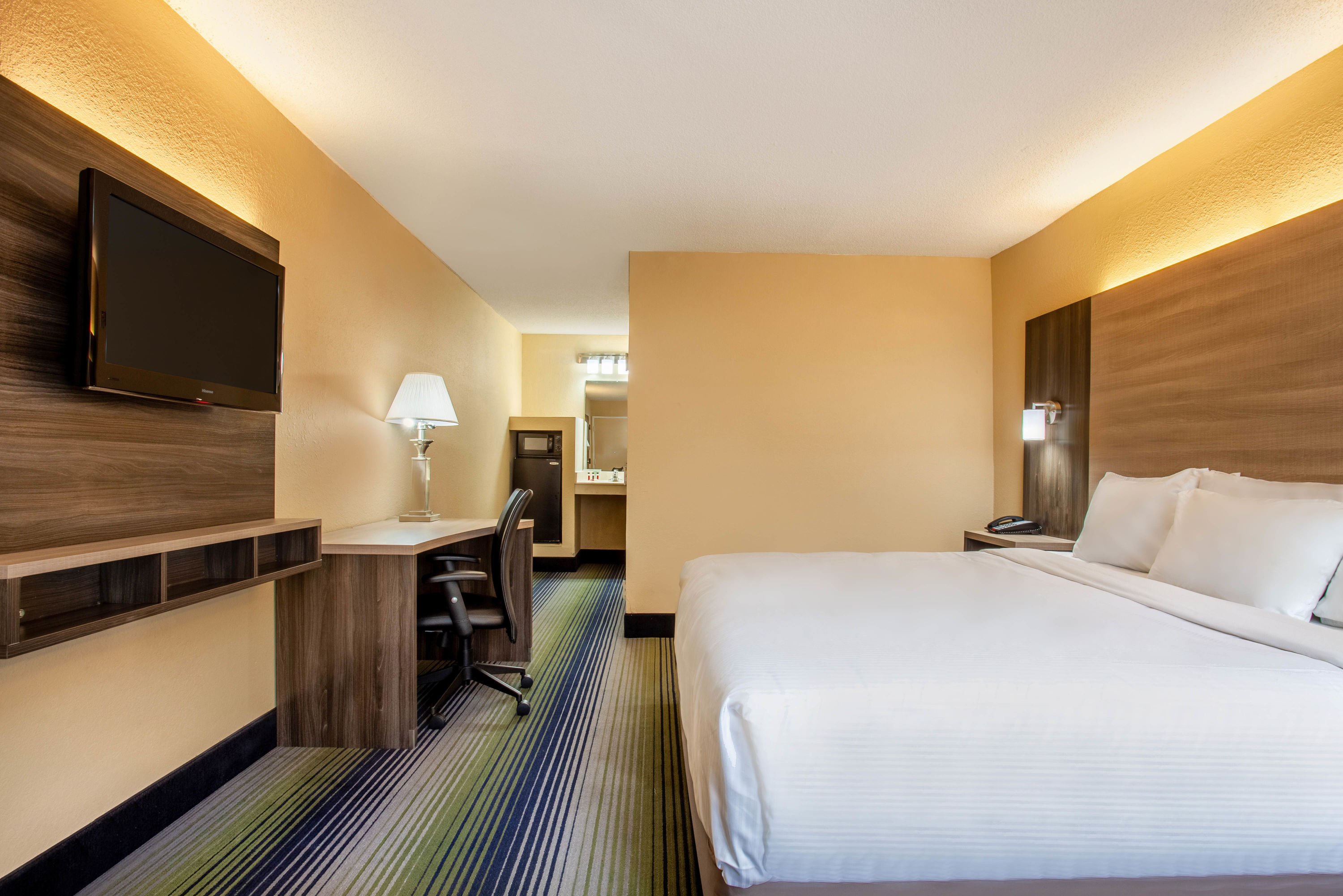 Guest room at the Baymont by Wyndham McDonough in McDonough, Georgia