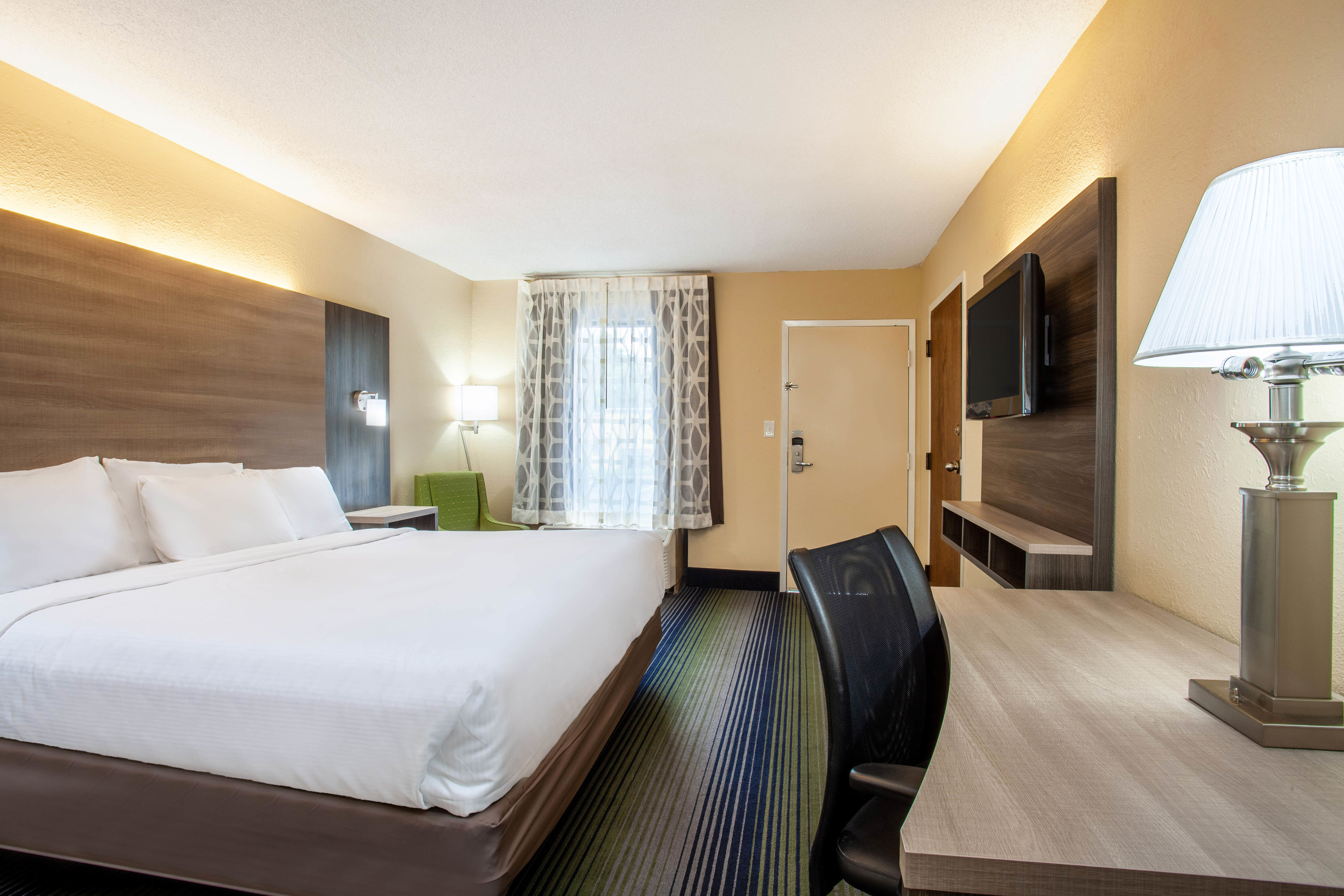 Guest room at the Baymont by Wyndham McDonough in McDonough, Georgia