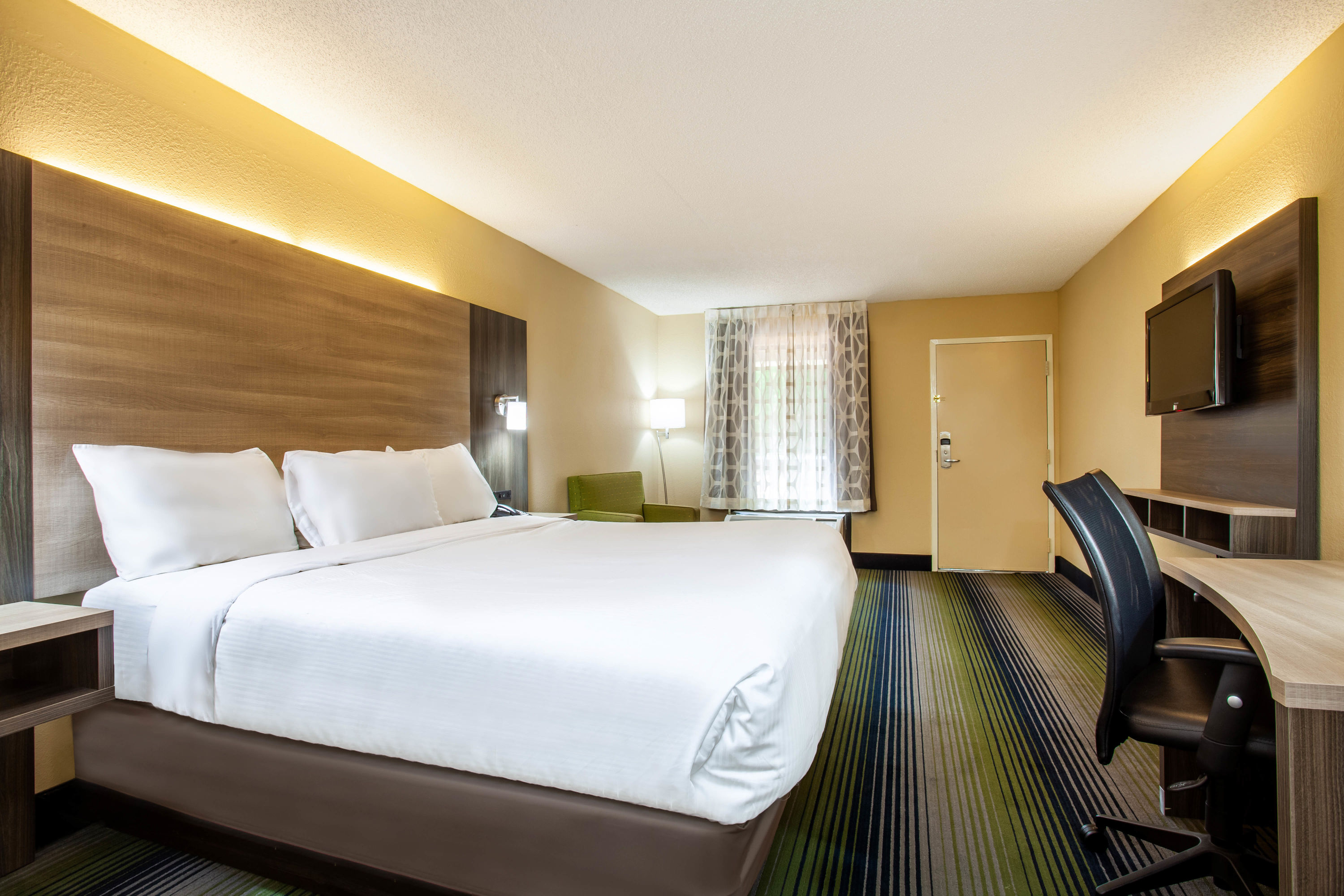 Guest room at the Baymont by Wyndham McDonough in McDonough, Georgia