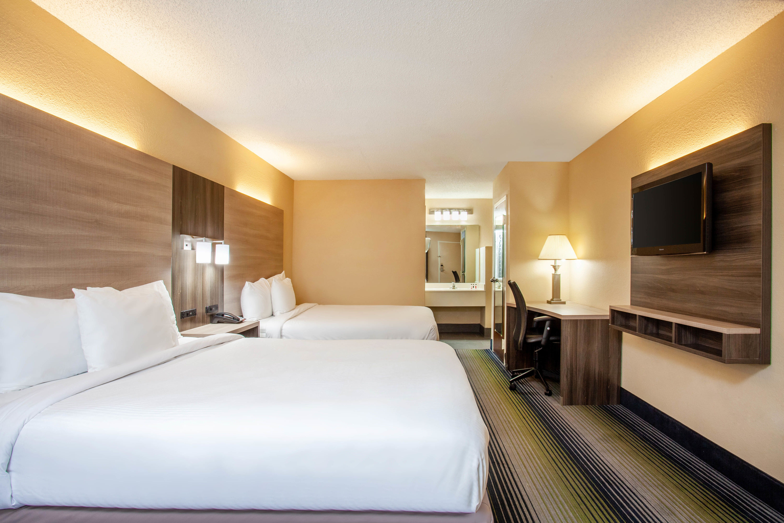 Guest room at the Baymont by Wyndham McDonough in McDonough, Georgia