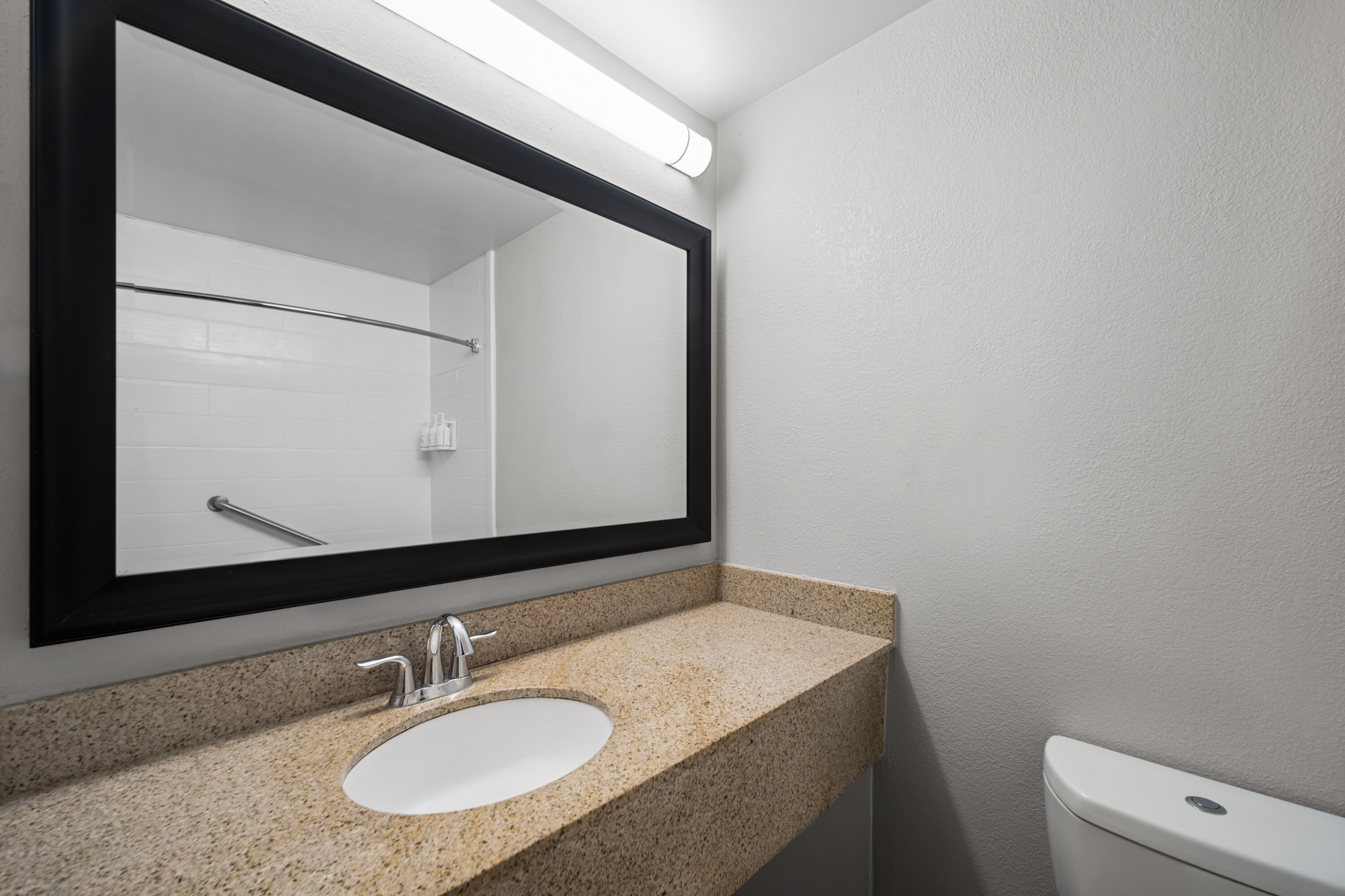 Guest room bath at the Baymont Inn & Suites by Wyndham Morrow/Atlanta I-75 South in Morrow, Georgia