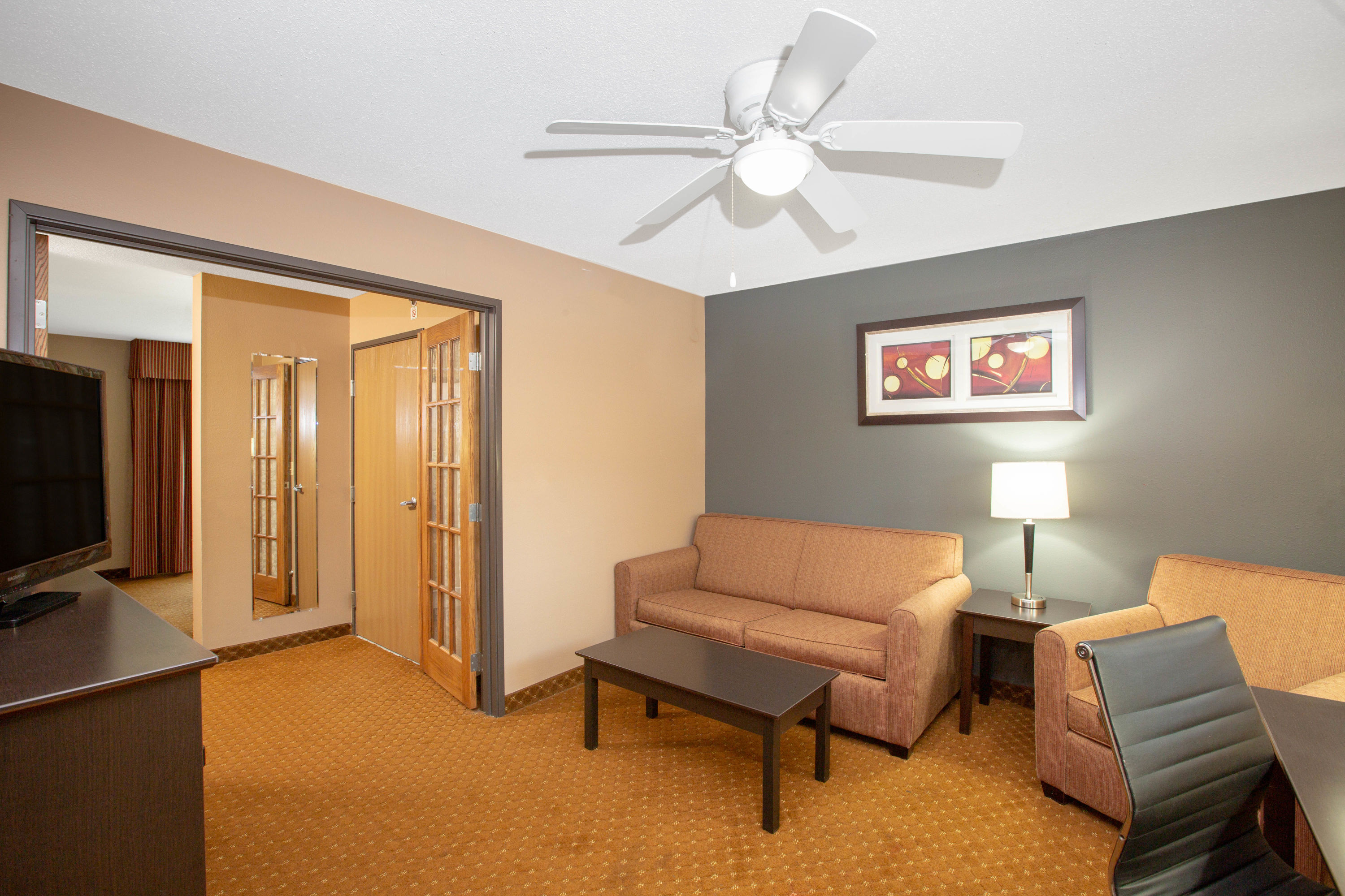 Baymont by Wyndham Coralville suite living room in Coralville, Iowa
