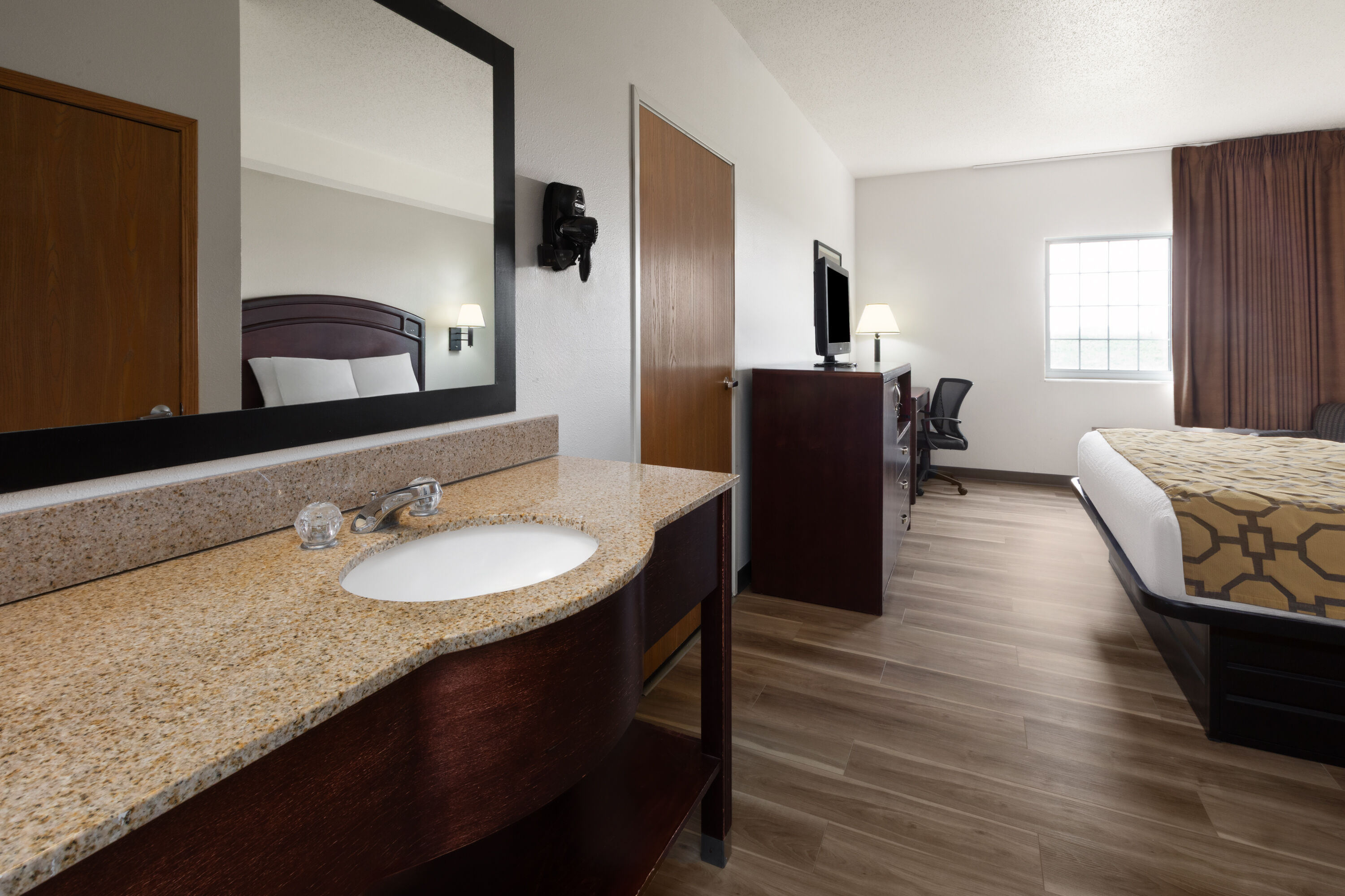 Guest room at the Baymont by Wyndham Harlan in Harlan, Iowa