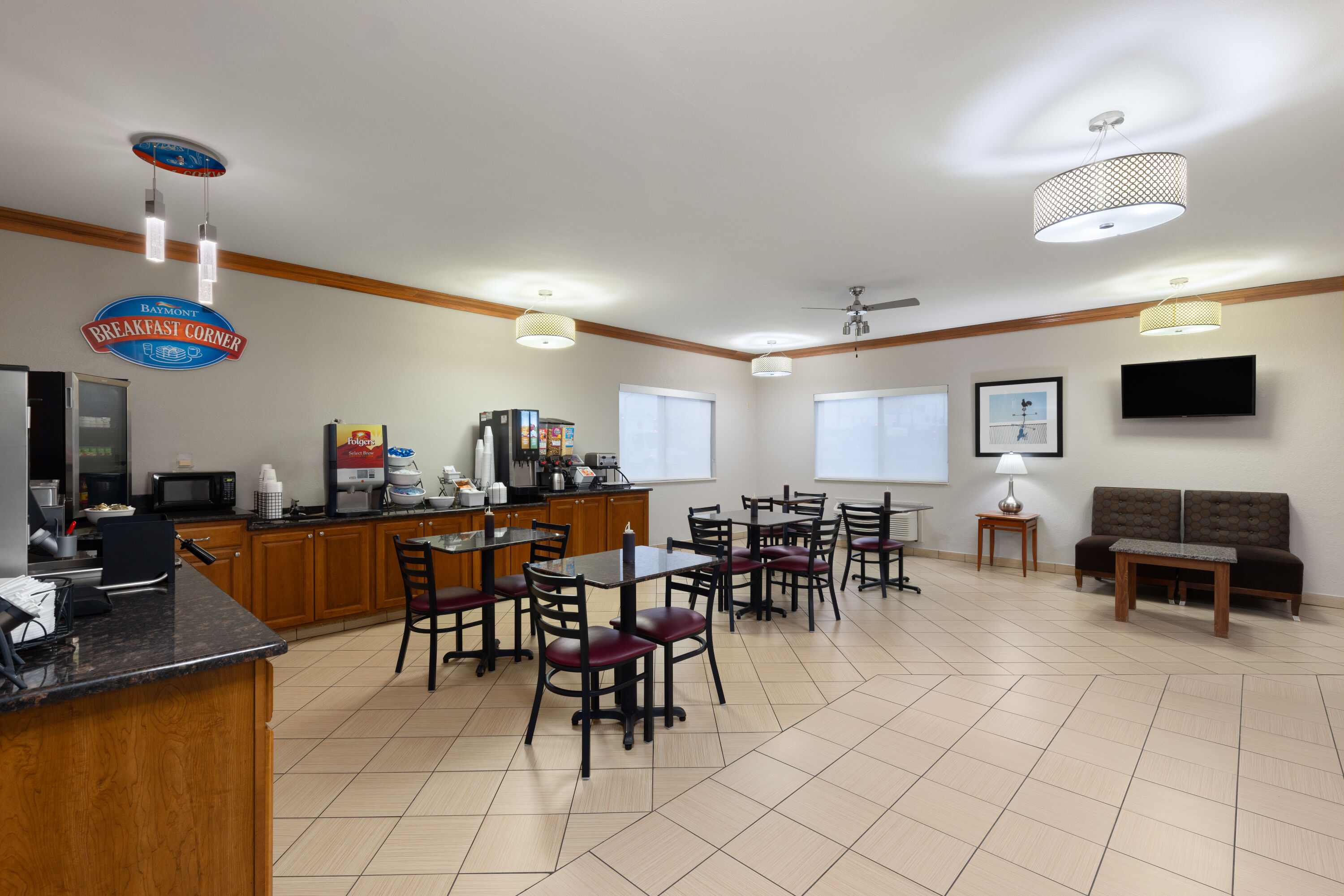 Baymont by Wyndham Waterloo restaurant breakfast area with seating in Waterloo, Iowa