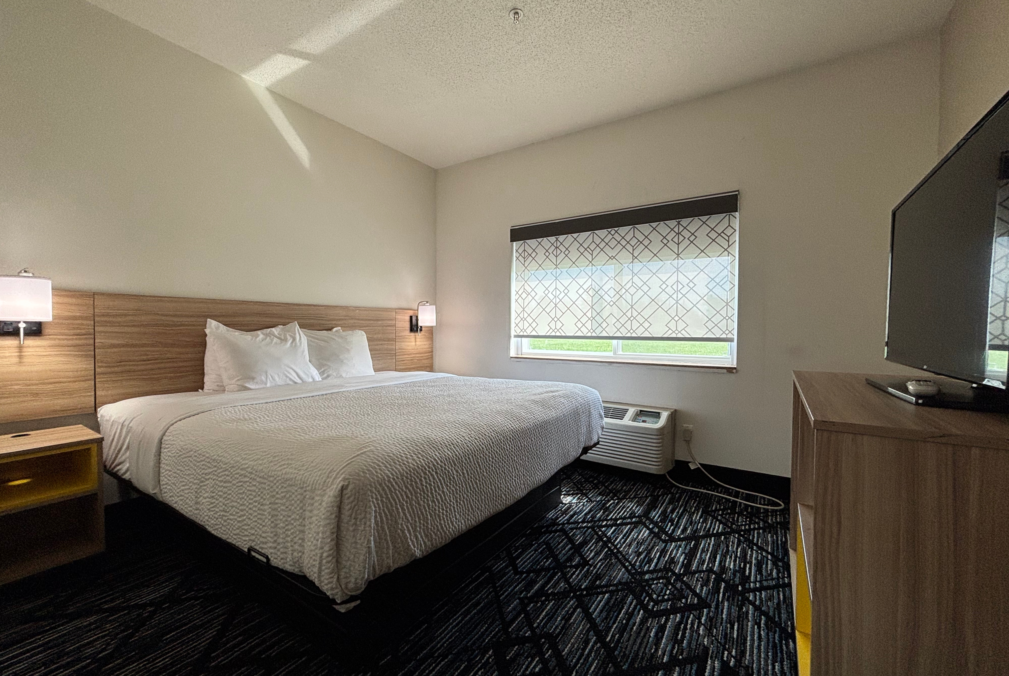 King bed guest room at the Baymont by Wyndham Decatur IL North in Decatur, Illinois