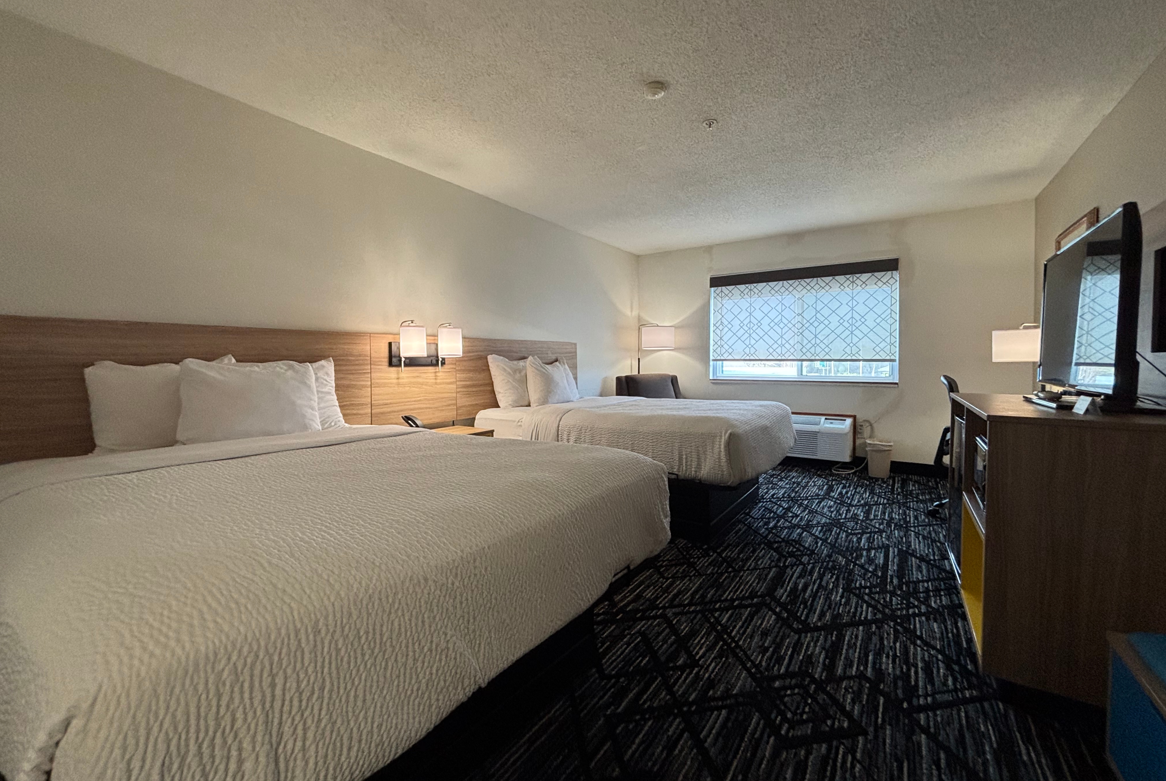 Queen bed guest room at the Baymont by Wyndham Decatur IL North in Decatur, Illinois