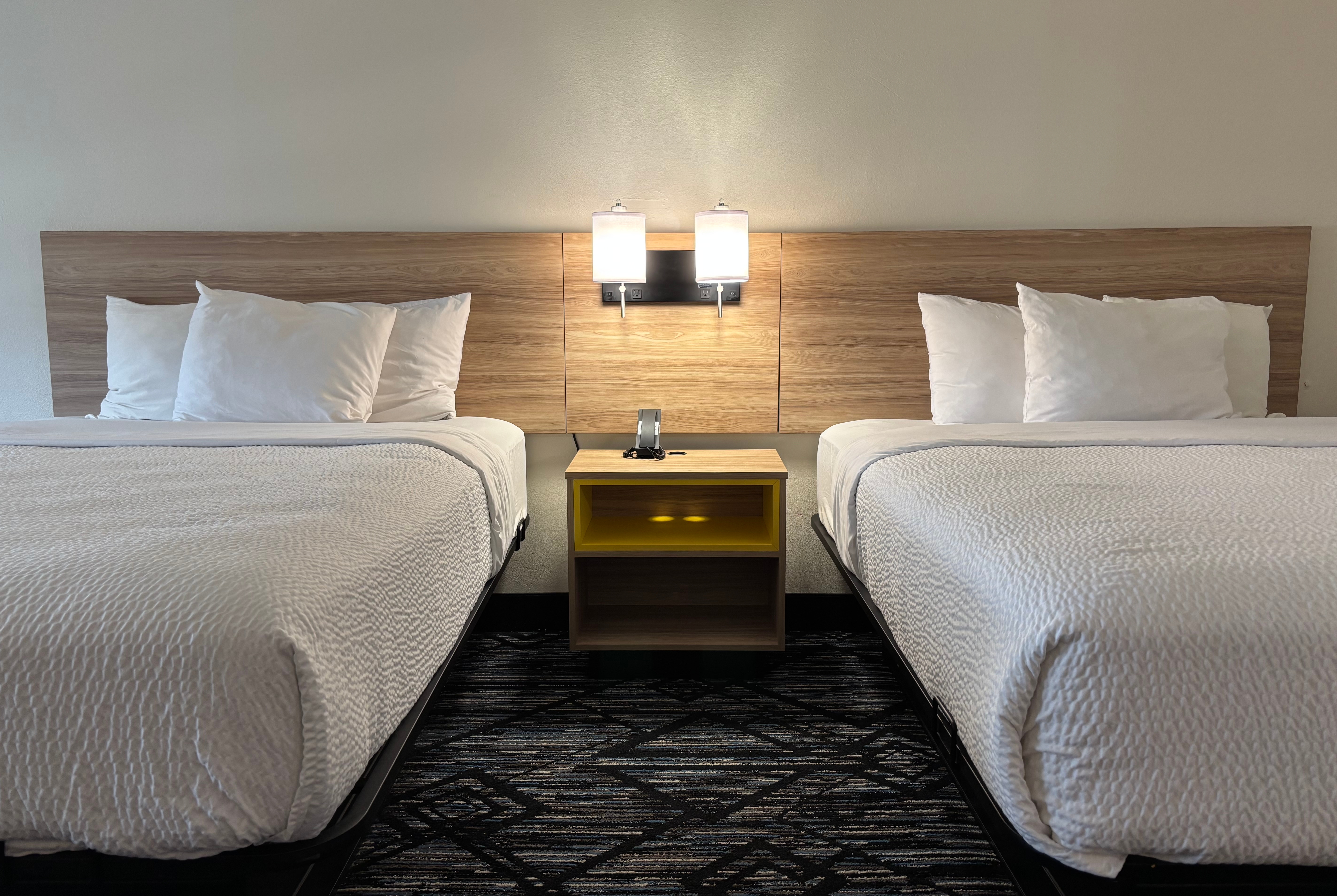 Queen bed guest room at the Baymont by Wyndham Decatur IL North in Decatur, Illinois