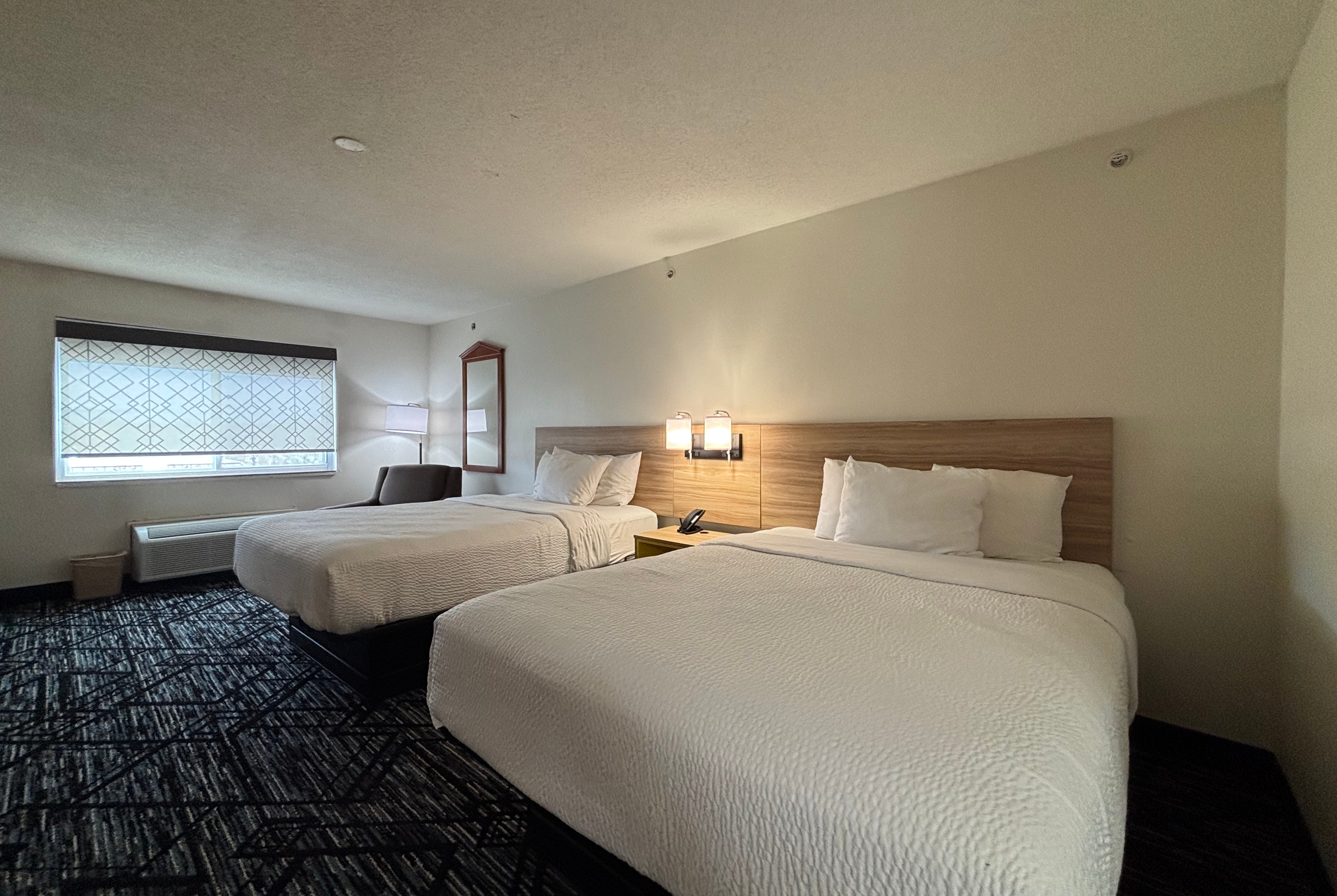 Queen bed guest room at the Baymont by Wyndham Decatur IL North in Decatur, Illinois