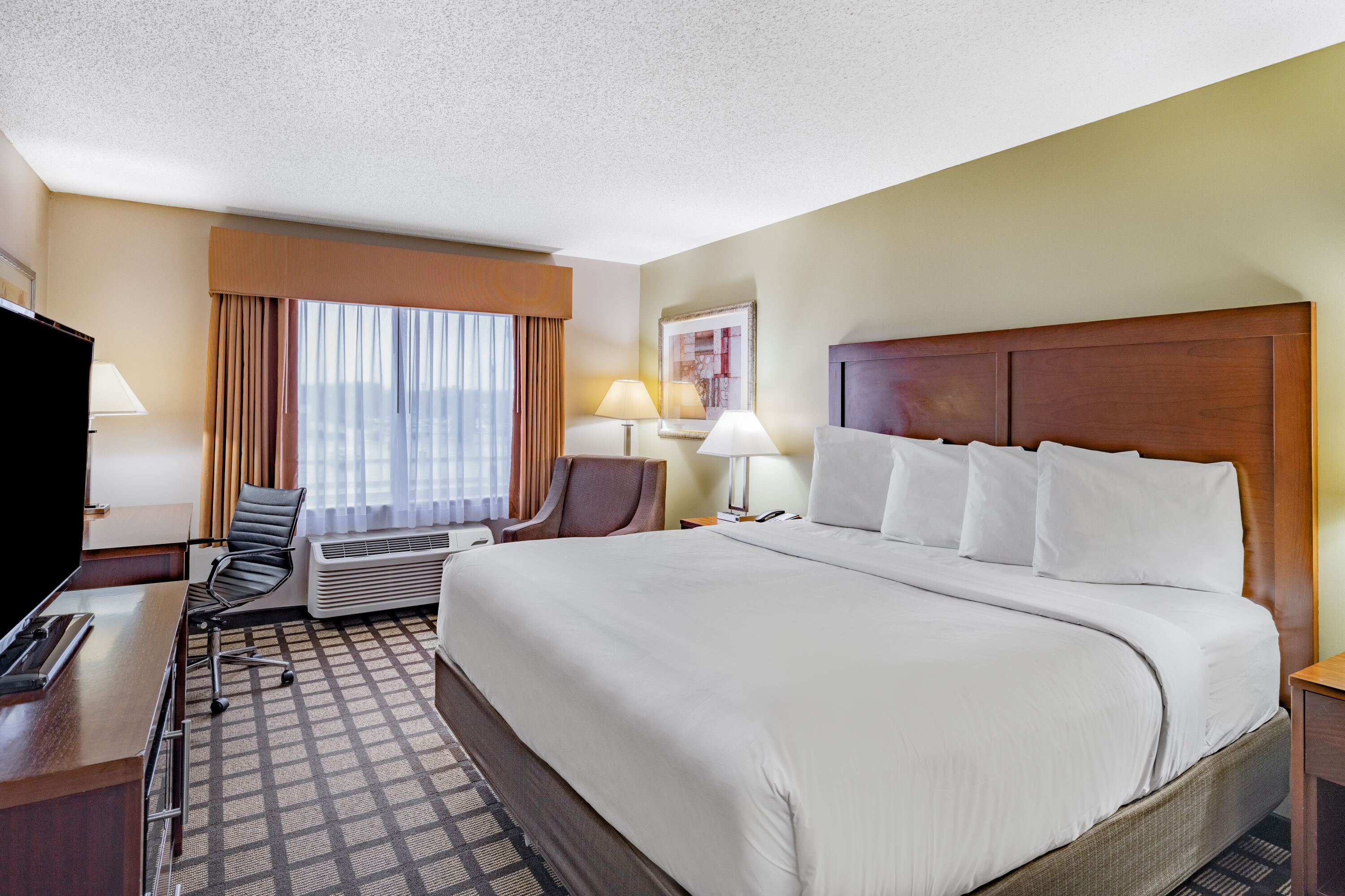 Guest room at the Baymont by Wyndham Gurnee in Gurnee, Illinois