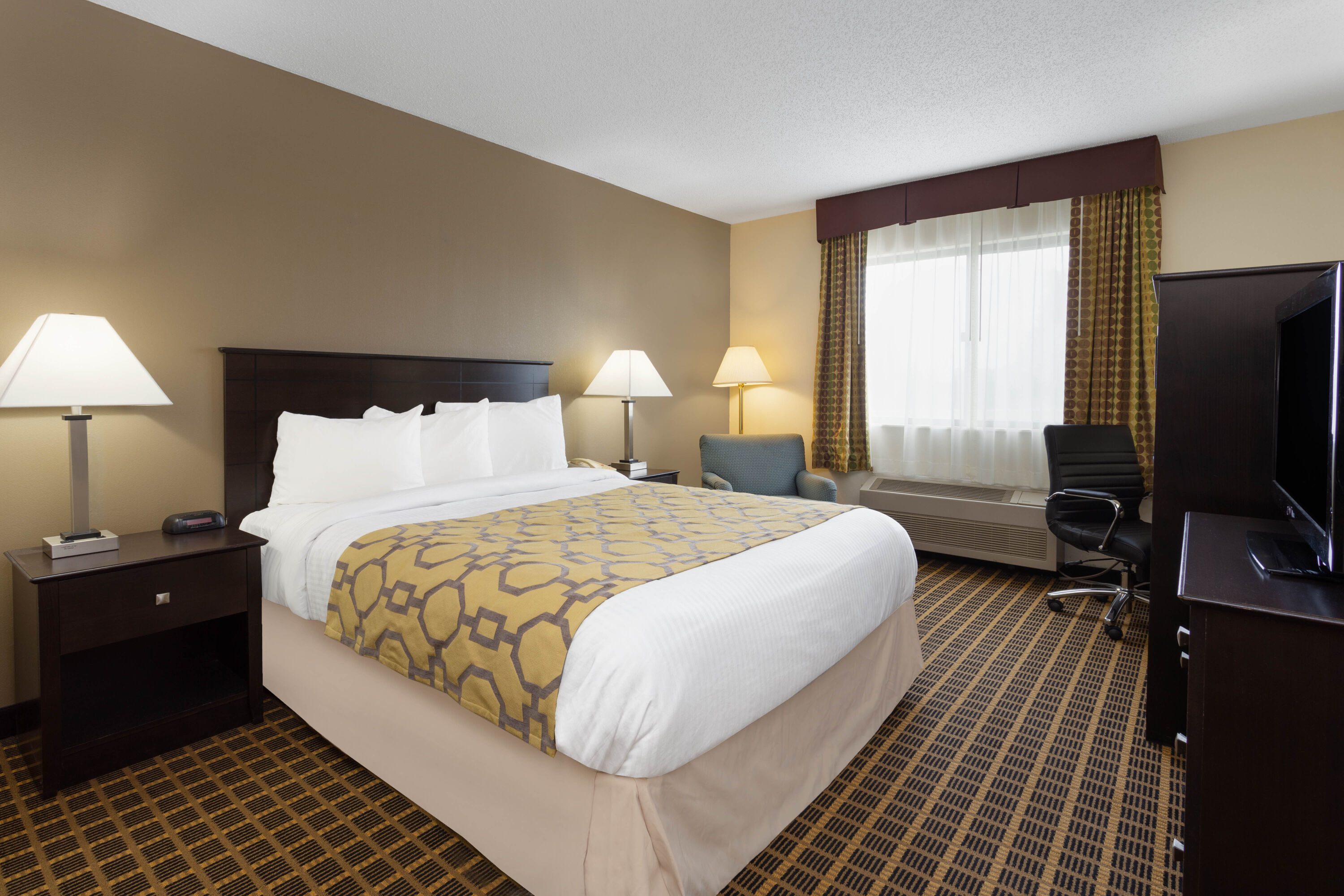 Guest room at the Baymont by Wyndham Harvard in Harvard, Illinois