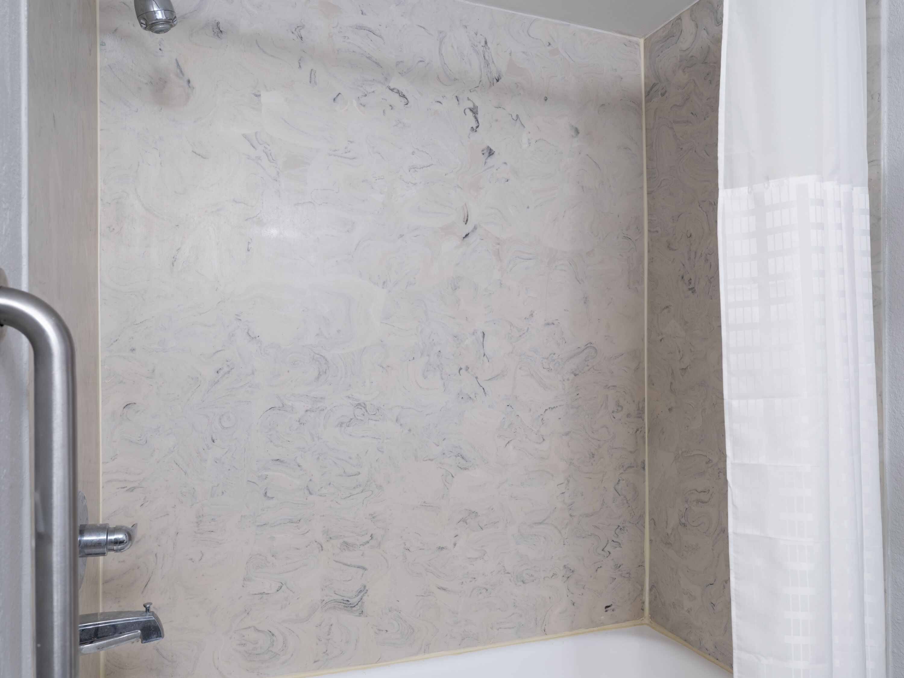 Guest room bath at the Baymont by Wyndham Indianapolis East in Indianapolis, Indiana