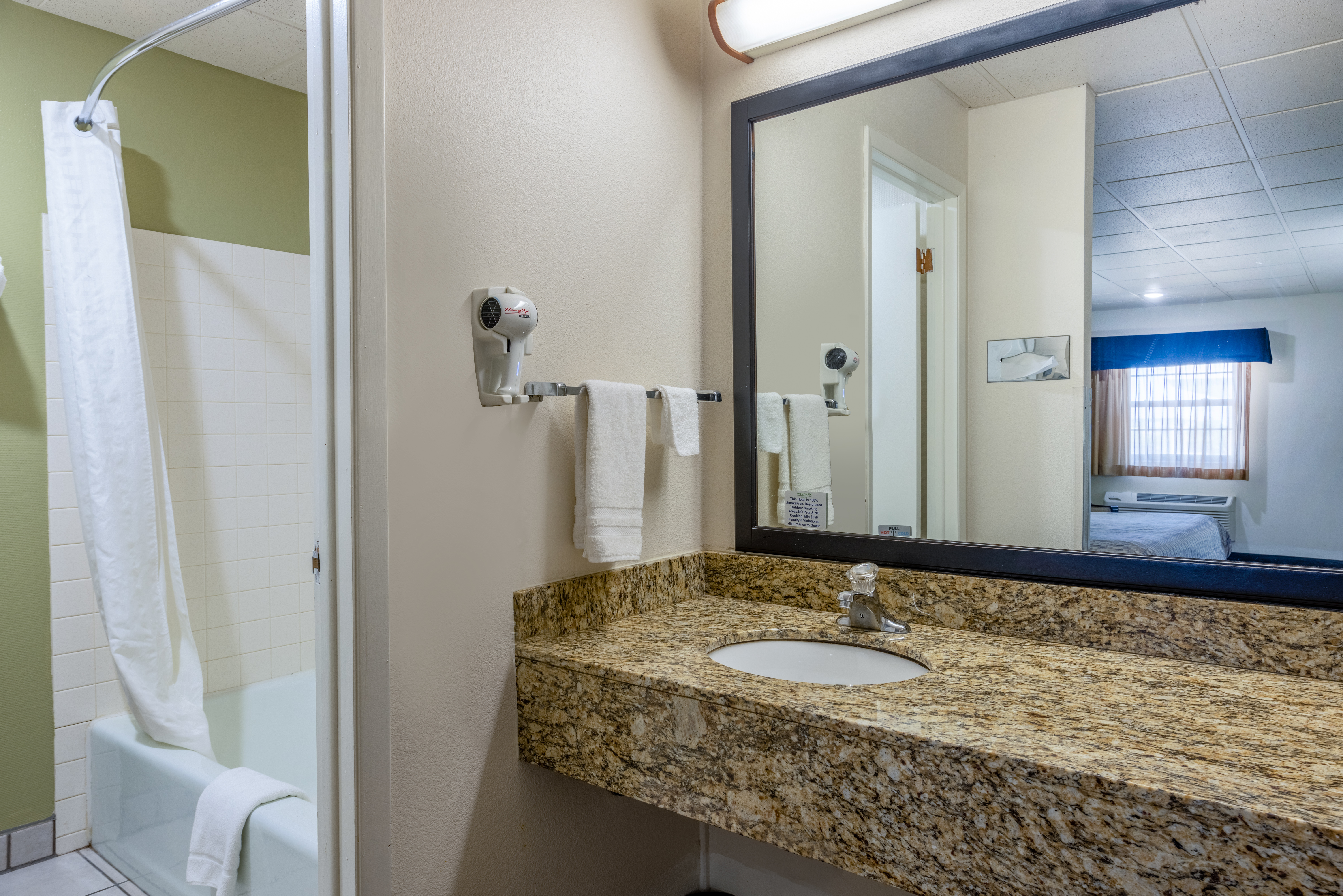 Guest room bath at the Baymont by Wyndham El Dorado in El Dorado, Kansas