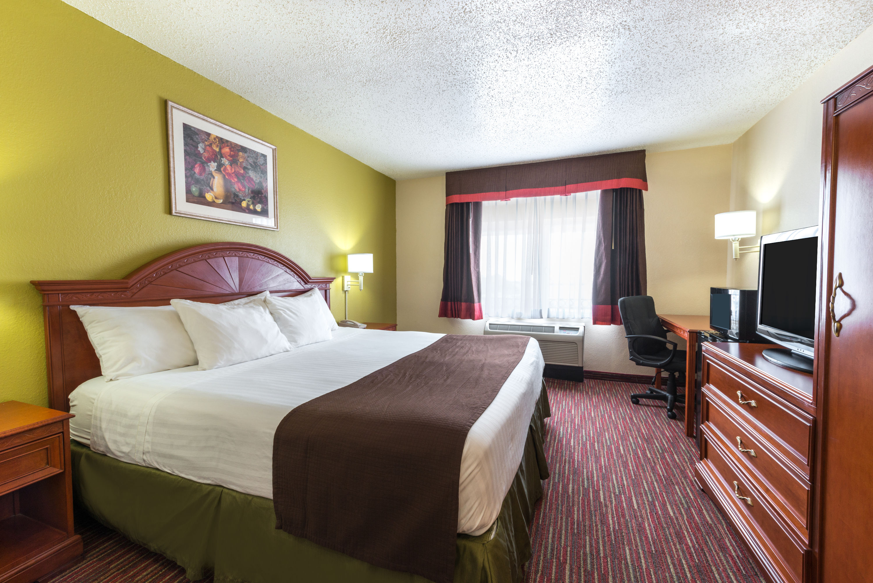 Guest room at the Baymont by Wyndham Louisville East in Louisville, Kentucky