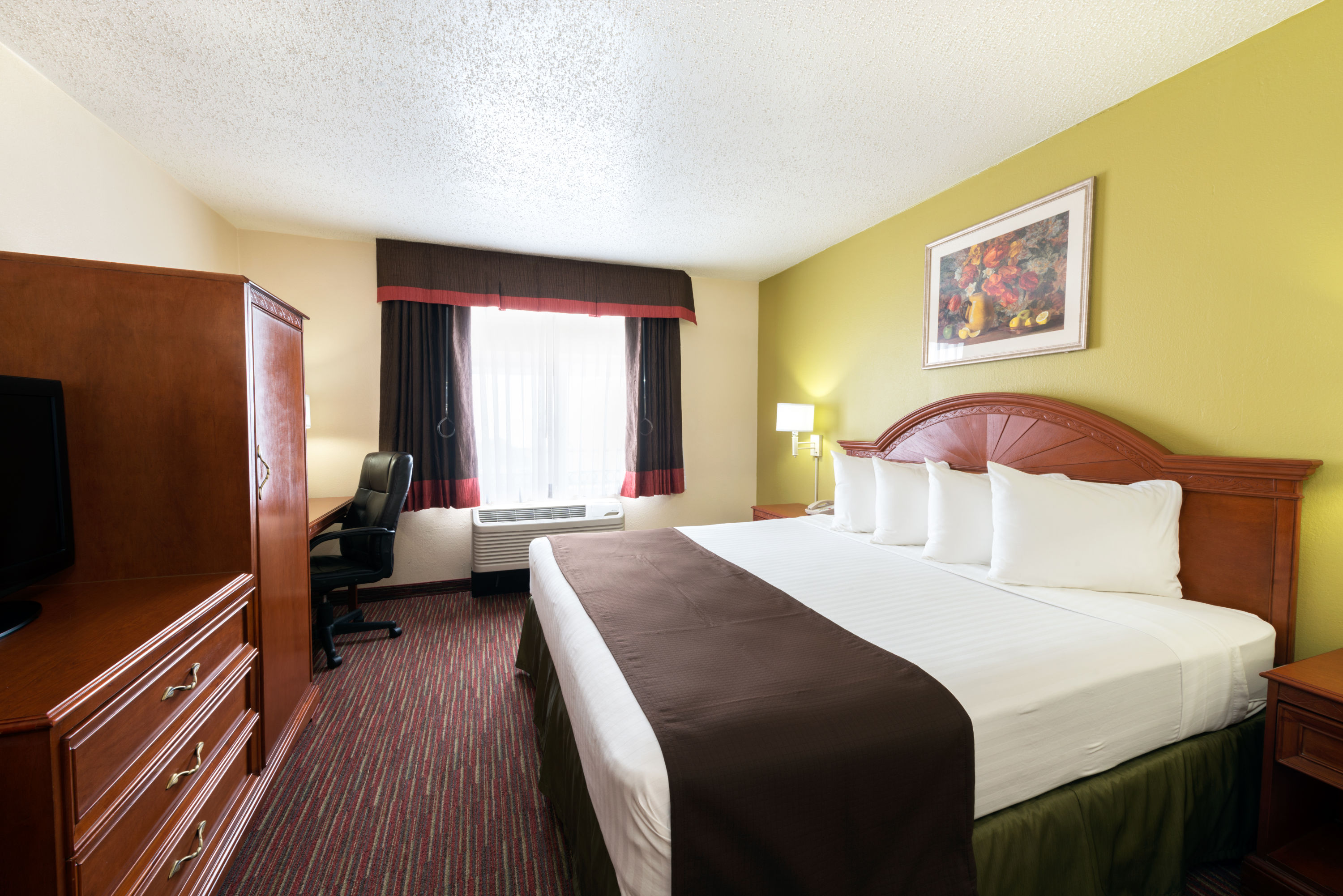 Guest room at the Baymont by Wyndham Louisville East in Louisville, Kentucky