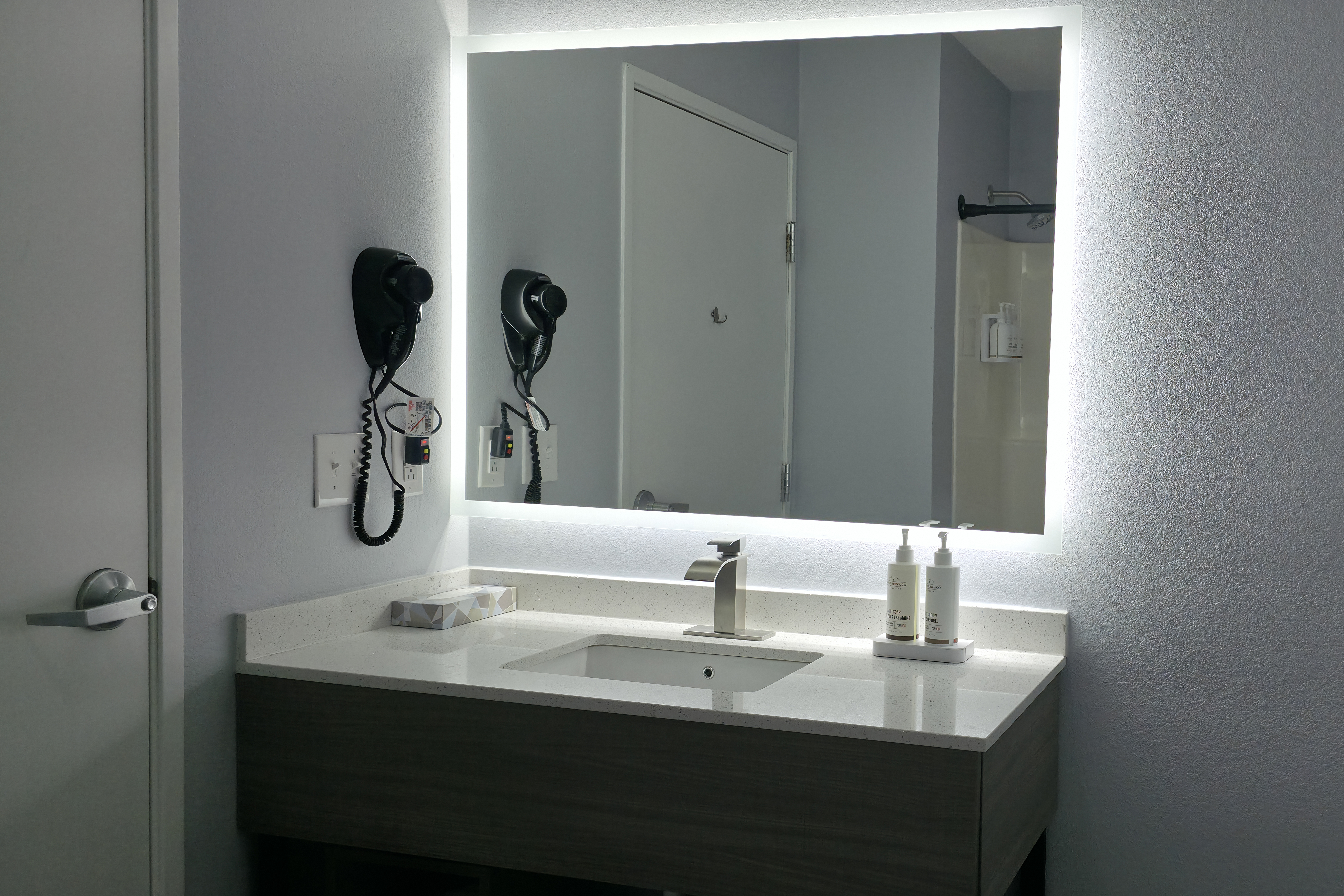 Guest room bath at the Baymont by Wyndham Louisville Southwest in Louisville, Kentucky