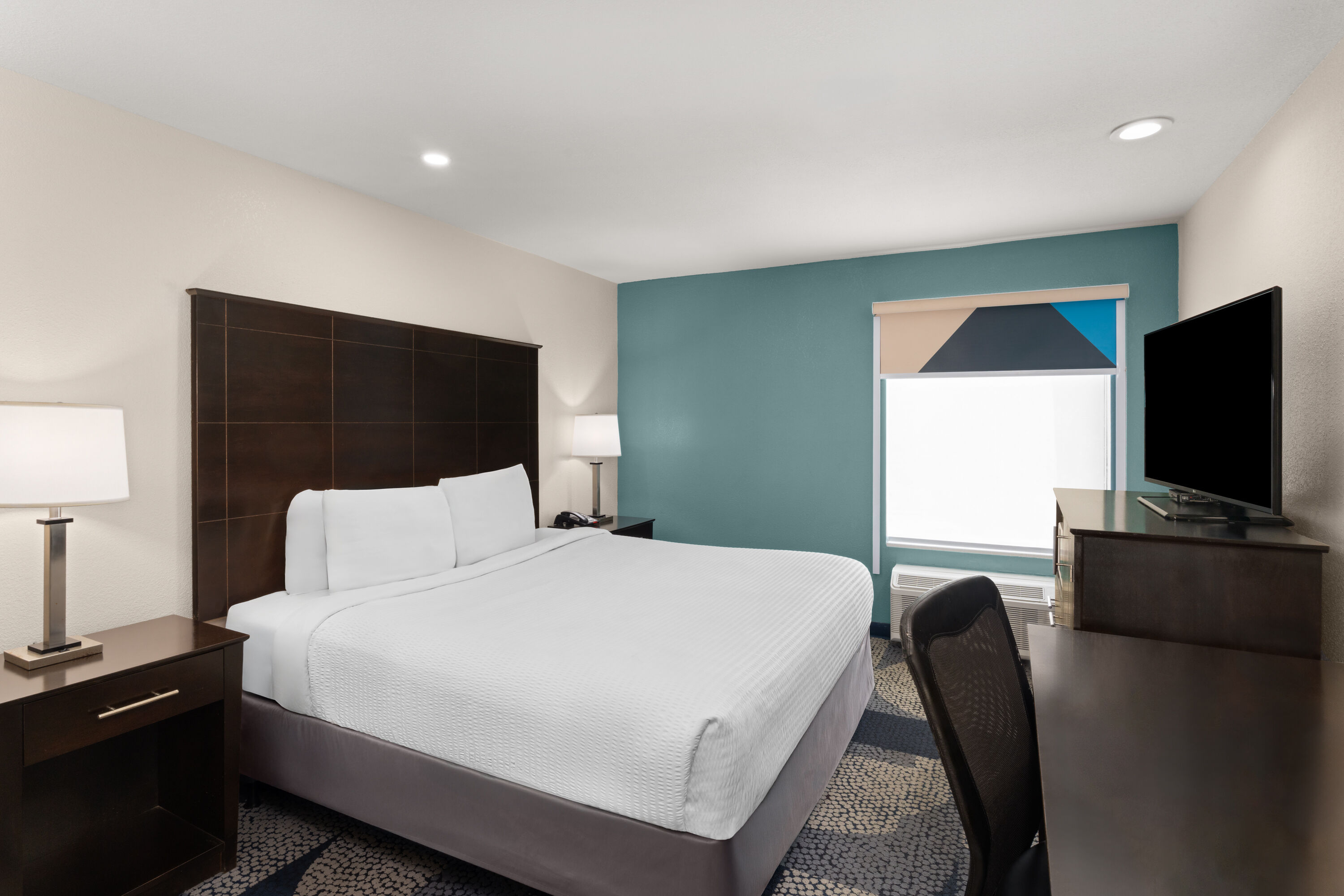 Guest room at the Baymont by Wyndham Iowa Lake Charles in Iowa, Louisiana