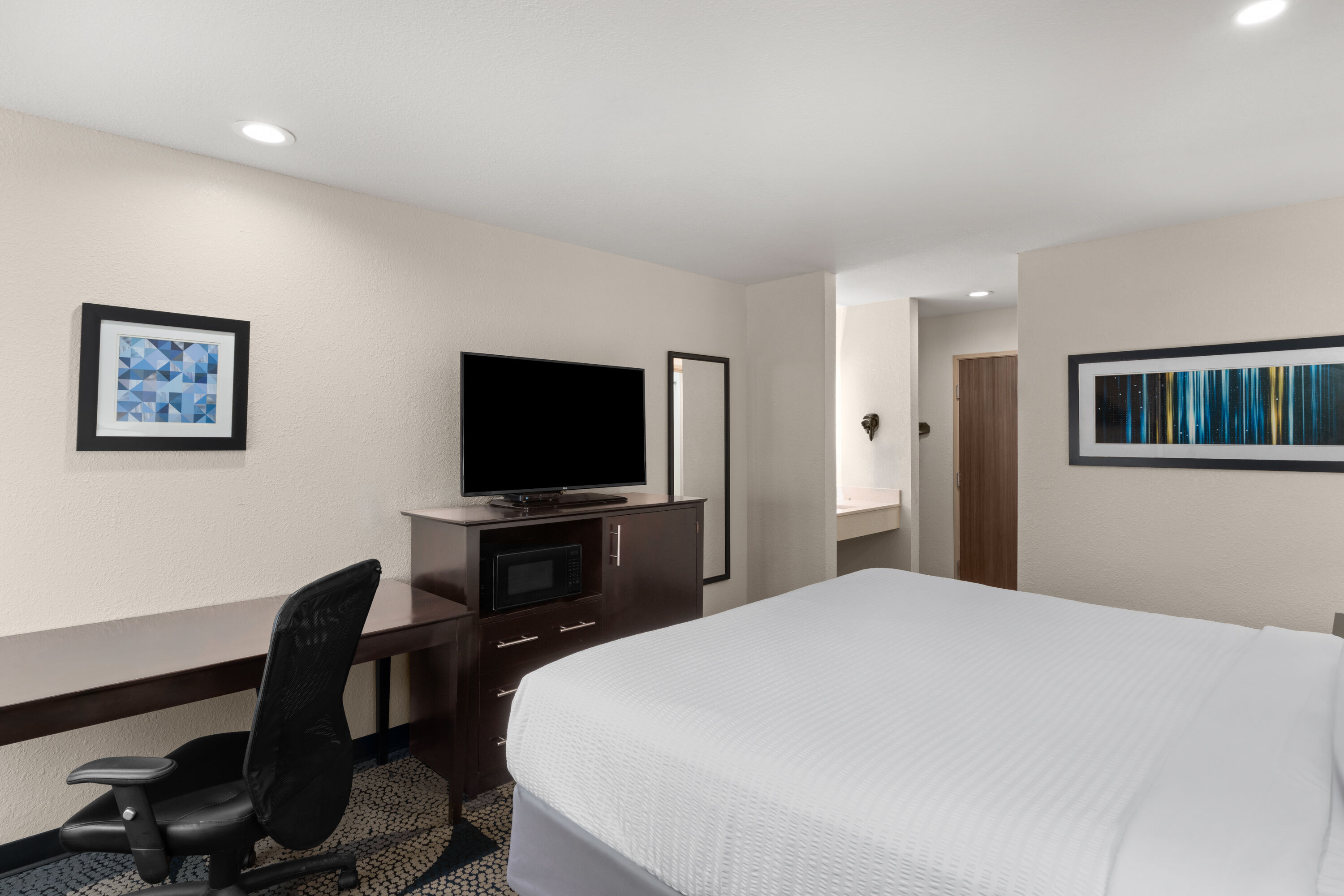 Guest room at the Baymont by Wyndham Iowa Lake Charles in Iowa, Louisiana