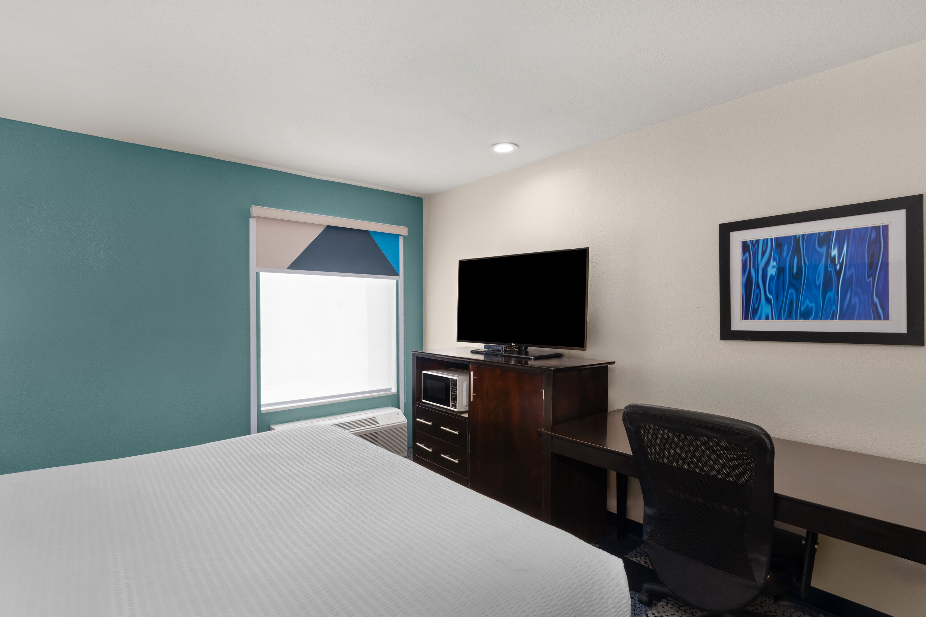 Guest room at the Baymont by Wyndham Iowa Lake Charles in Iowa, Louisiana