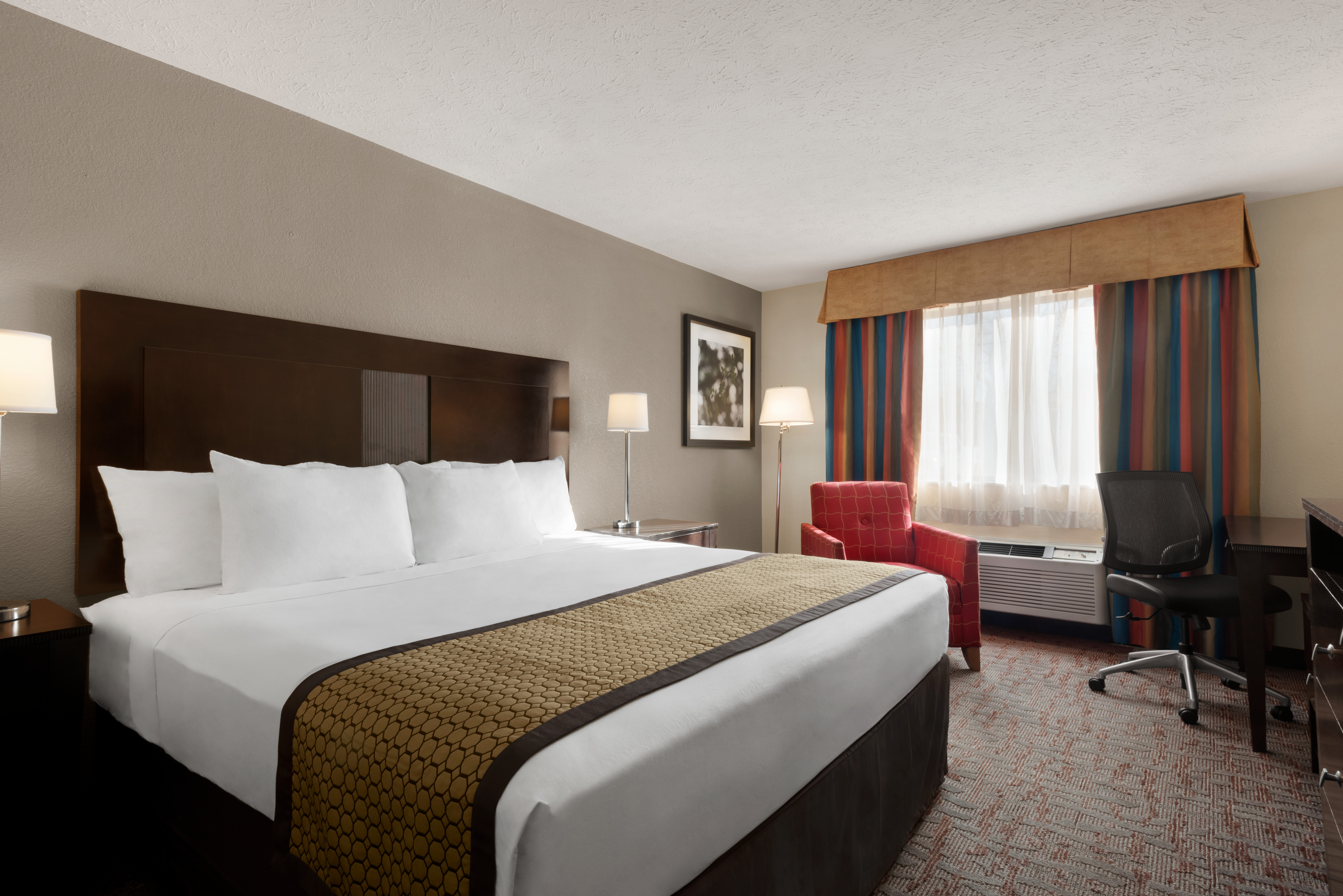 Guest room at the Baymont by Wyndham Belleville Airport Area in Belleville, Michigan
