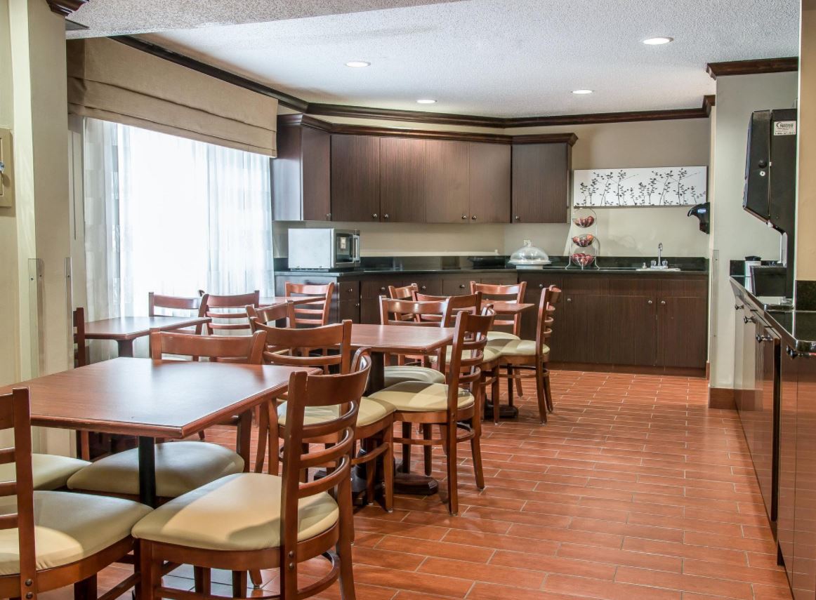 Baymont by Wyndham Flat Rock restaurant breakfast area with seating in Flat Rock, Michigan